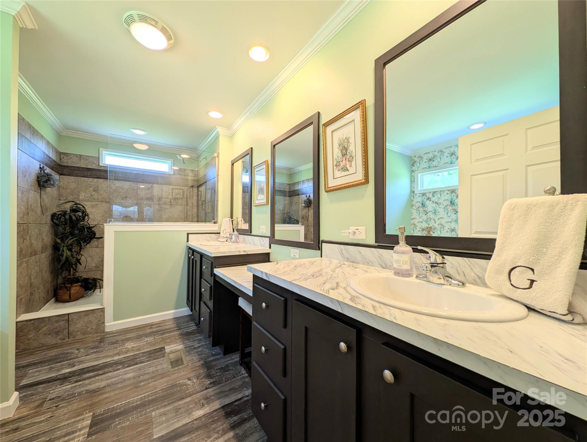 4713 White Store Road Wingate, NC 28174 - Photo 23 of 44 a bathroom with a sink double vanity and a mirror