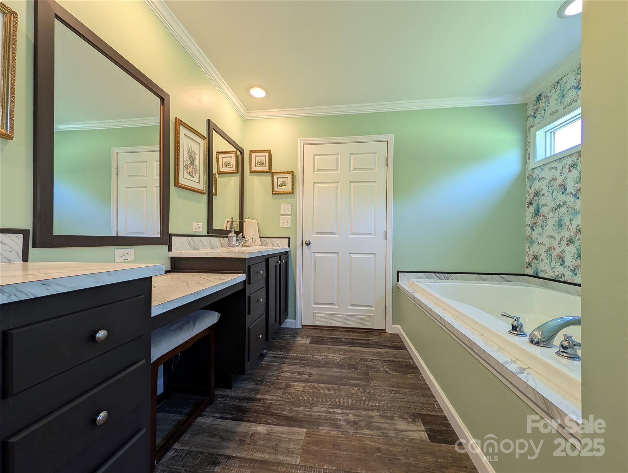 4713 White Store Road Wingate, NC 28174 - Photo 24 of 44 a bathroom with a tub a sink and mirror