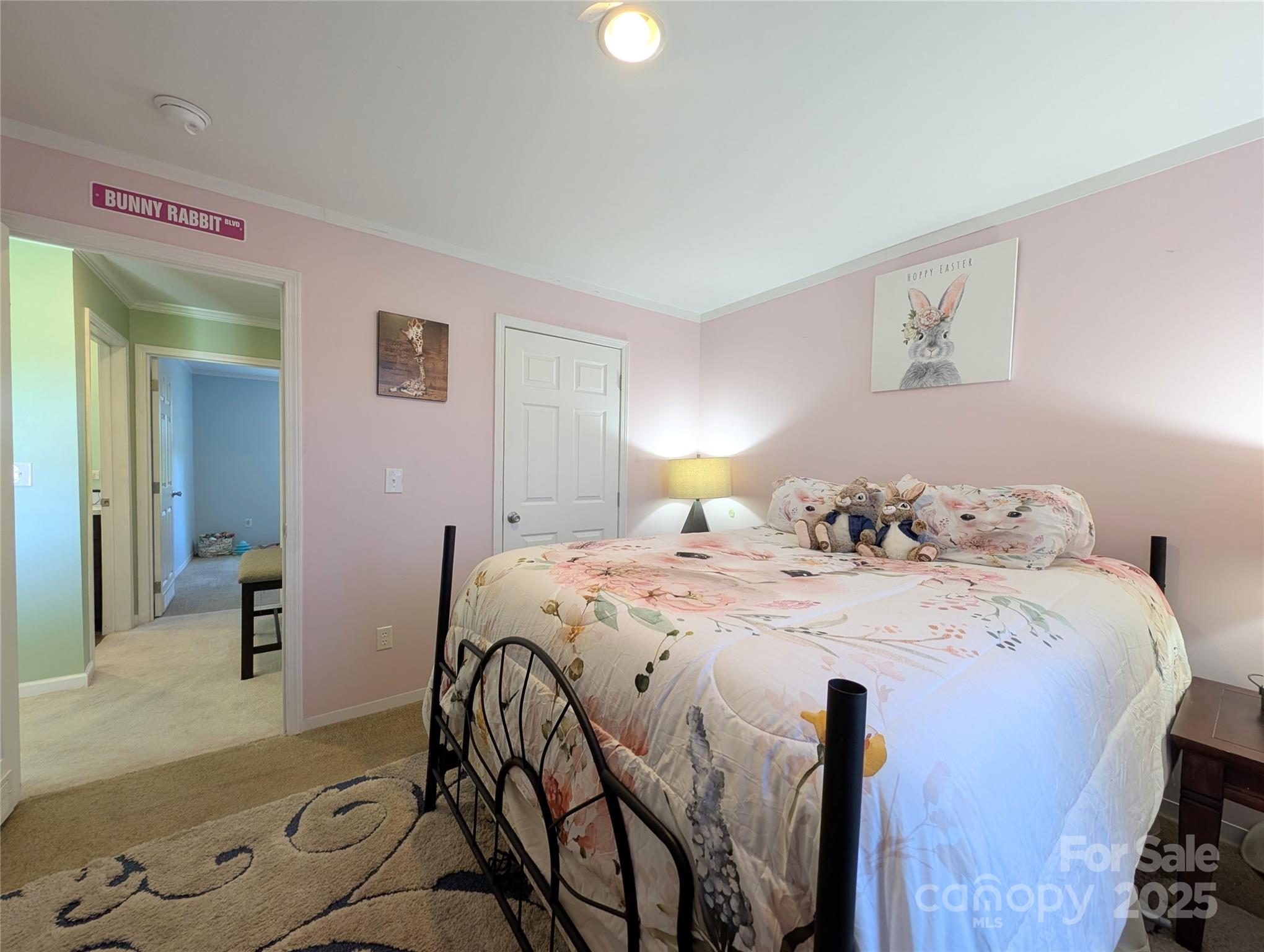 4713 White Store Road Wingate, NC 28174 - Photo 29 of 44 a spacious bedroom with a bed and a table in it