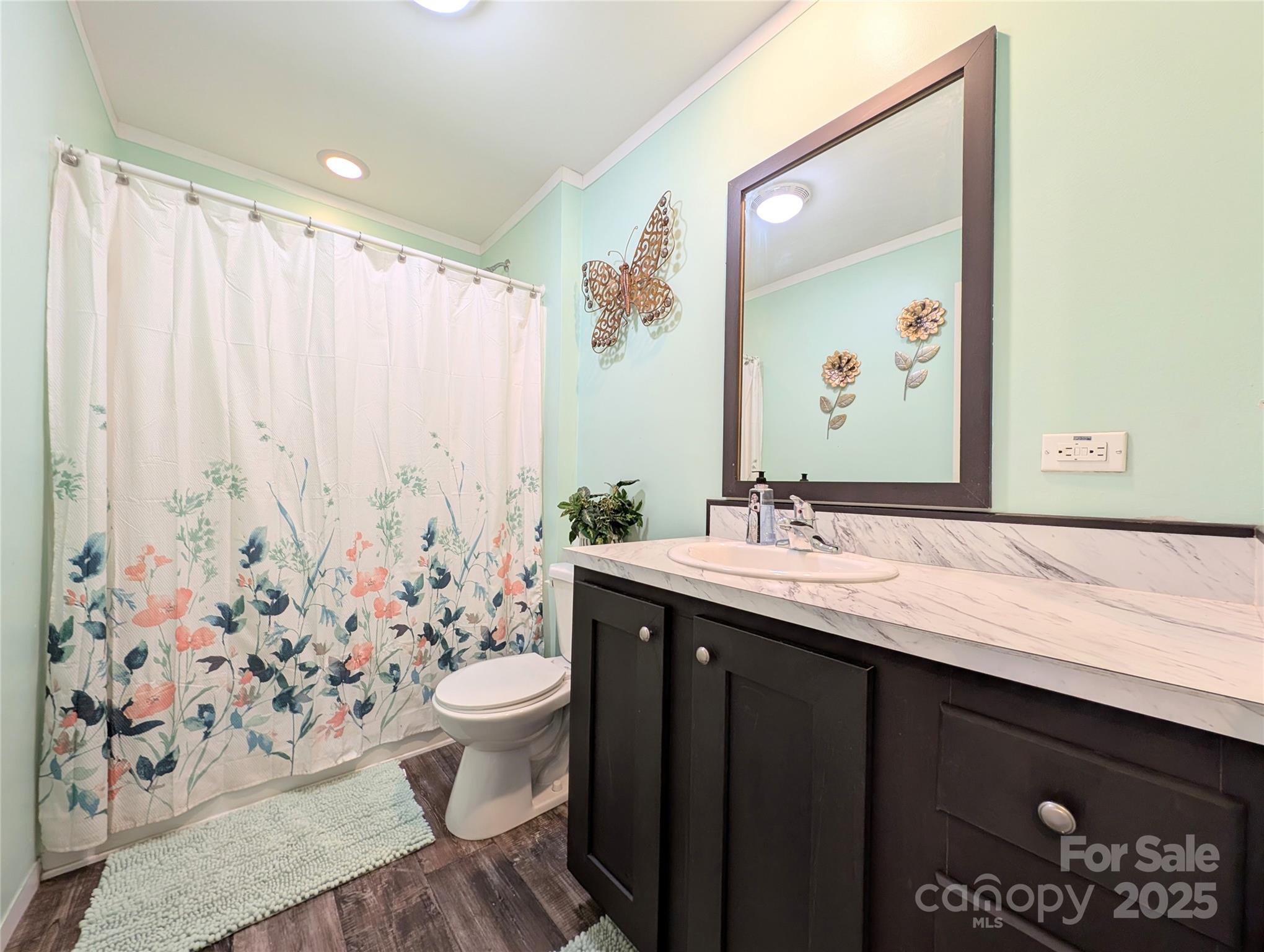4713 White Store Road Wingate, NC 28174 - Photo 30 of 44 a bathroom with a sink and a mirror