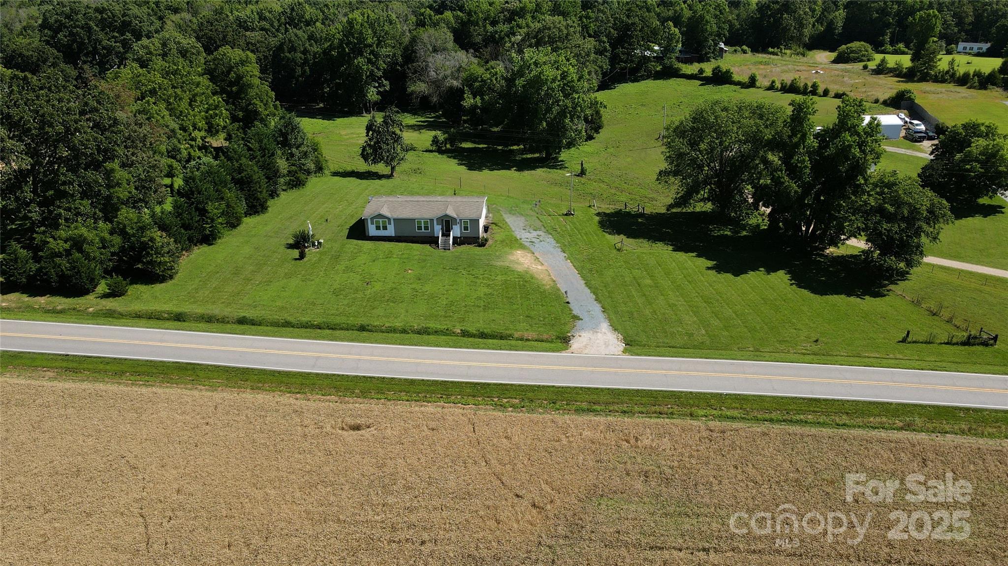 4713 White Store Road Wingate, NC 28174 - Photo 3 of 44 a view of a yard with swimming pool