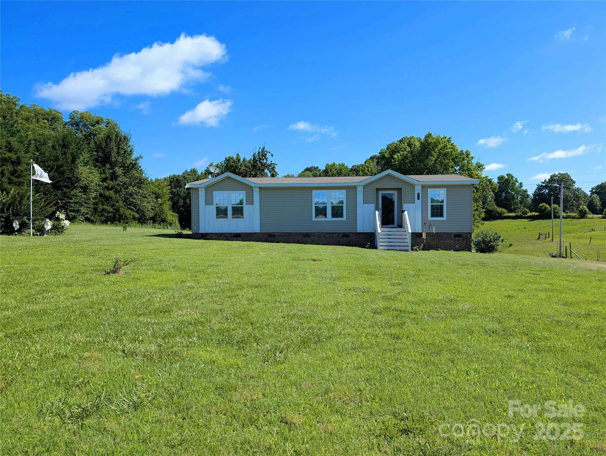 4713 White Store Road Wingate, NC 28174 - Photo 32 of 44 a view of a house with a big yard