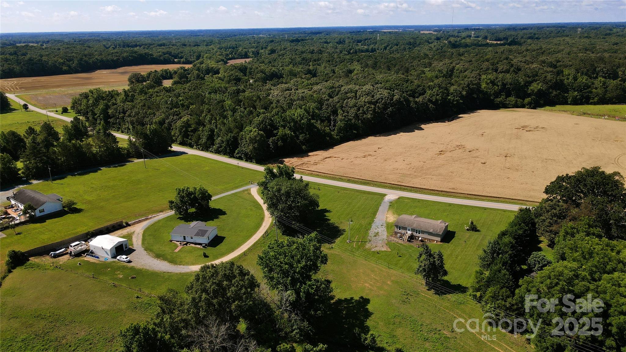 4713 White Store Road Wingate, NC 28174 - Photo 42 of 44 an aerial view of a house with outdoor space