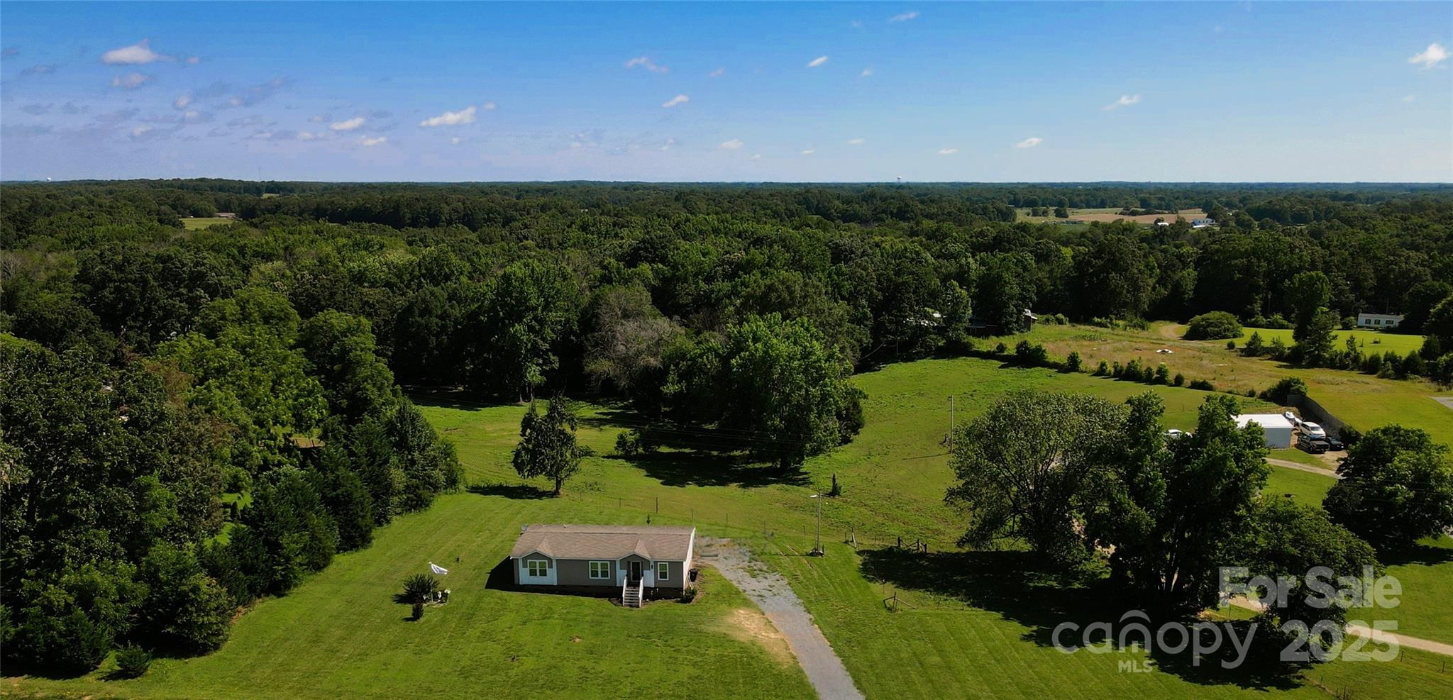 4713 White Store Road Wingate, NC 28174 - Photo 43 of 44 an aerial view of a house with a yard