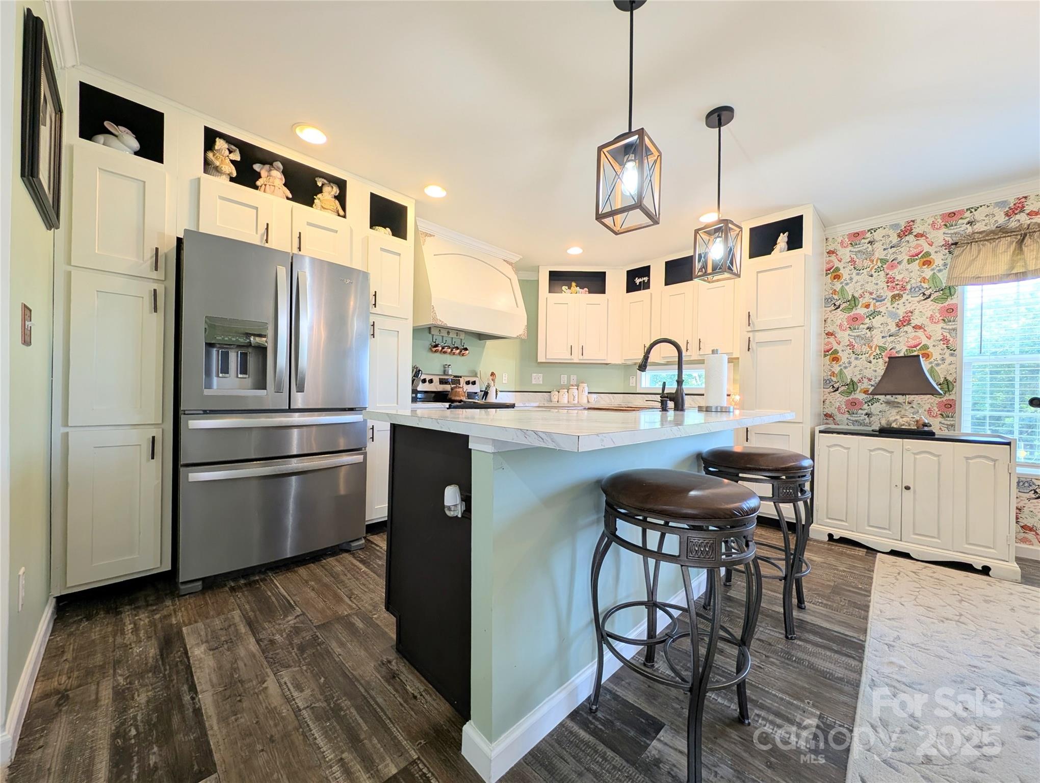 4713 White Store Road Wingate, NC 28174 - Photo 6 of 44 a kitchen with stainless steel appliances granite countertop a sink a stove and a refrigerator