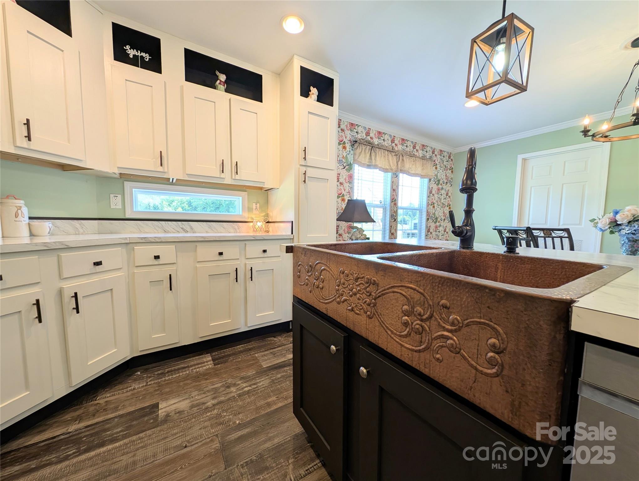 4713 White Store Road Wingate, NC 28174 - Photo 9 of 44 a kitchen with stainless steel appliances granite countertop a sink a stove and a wooden floors