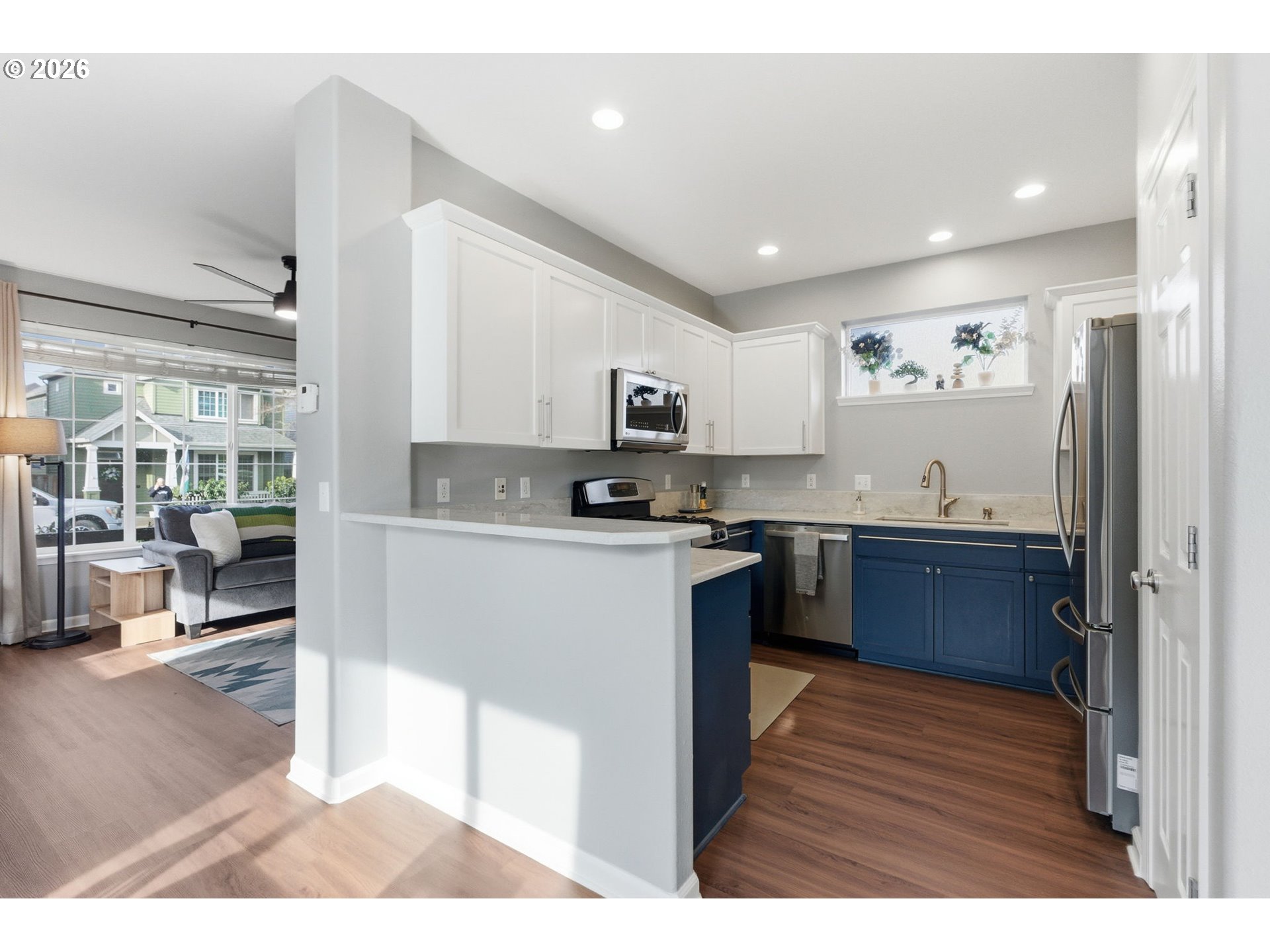 6144 Southwest 208th Place Beaverton, OR 97078 - Photo 13 of 41 a kitchen with granite countertop stainless steel appliances refrigerator cabinets and a sink