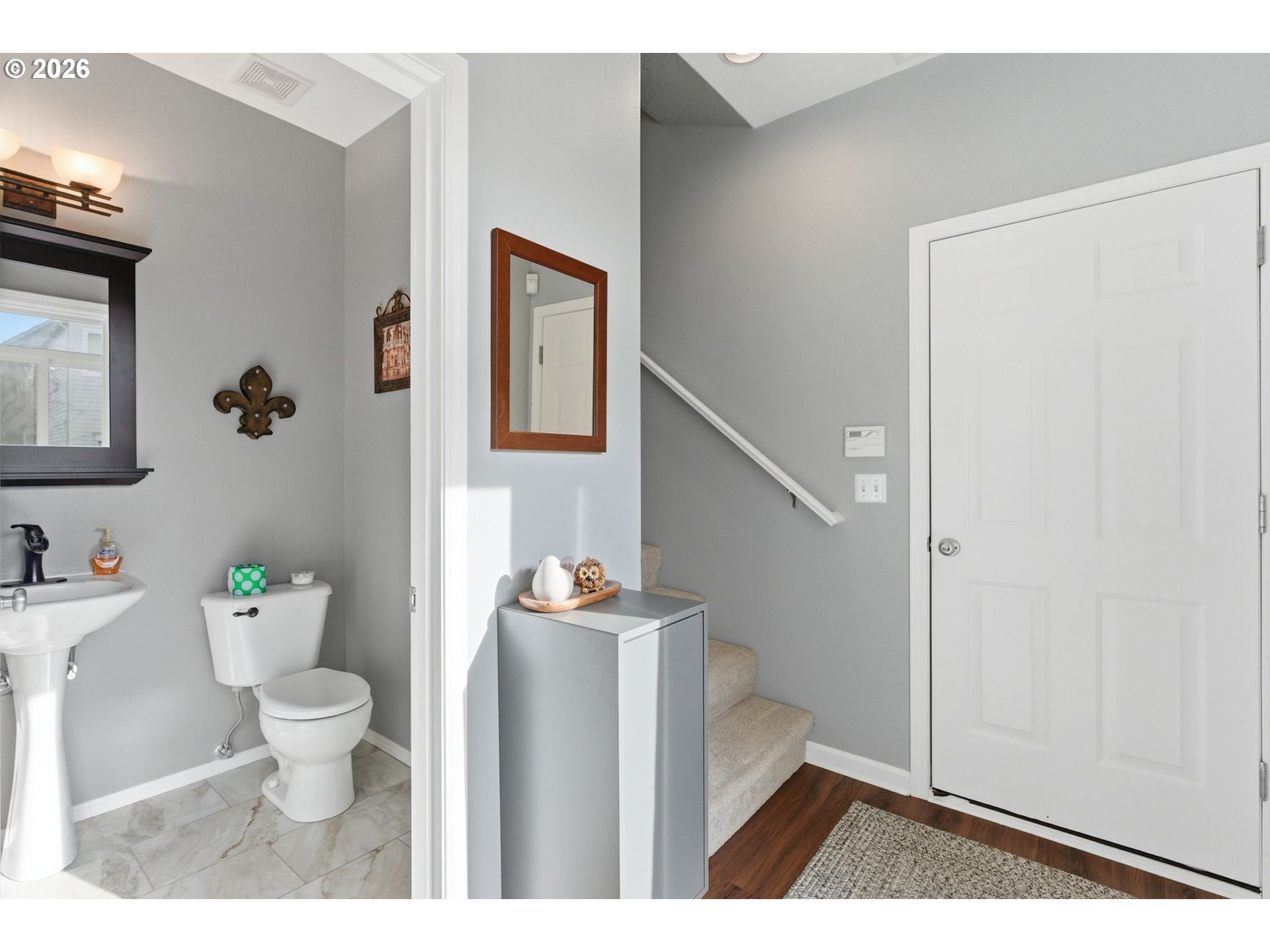 6144 Southwest 208th Place Beaverton, OR 97078 - Photo 17 of 41 a bathroom with a sink a toilet and a mirror
