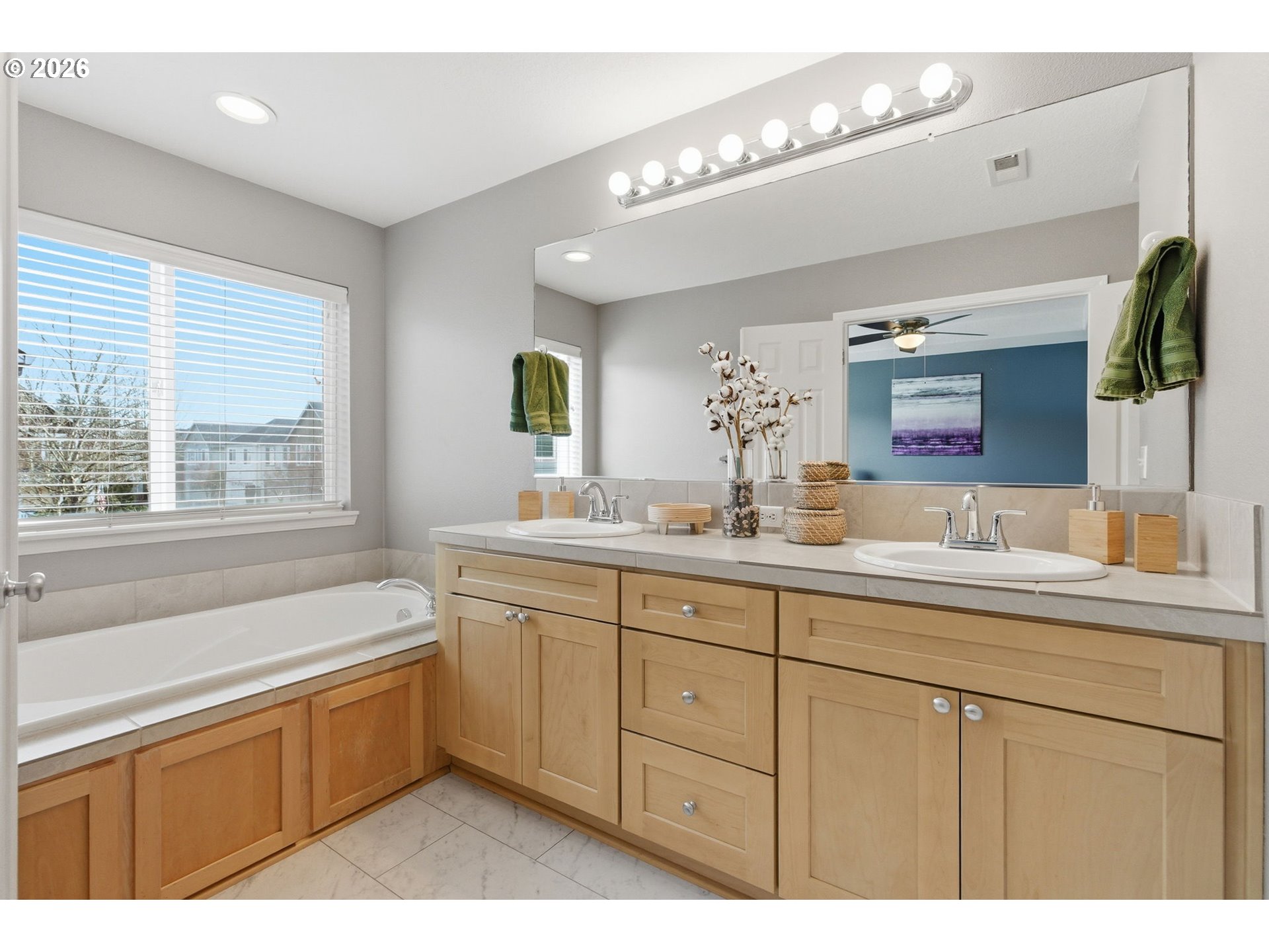 6144 Southwest 208th Place Beaverton, OR 97078 - Photo 26 of 41 a bathroom with a sink mirror and a bathtub