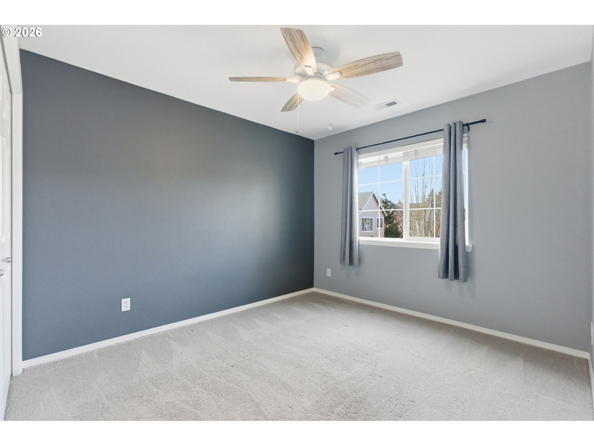 6144 Southwest 208th Place Beaverton, OR 97078 - Photo 31 of 41 a view of an empty room with a window