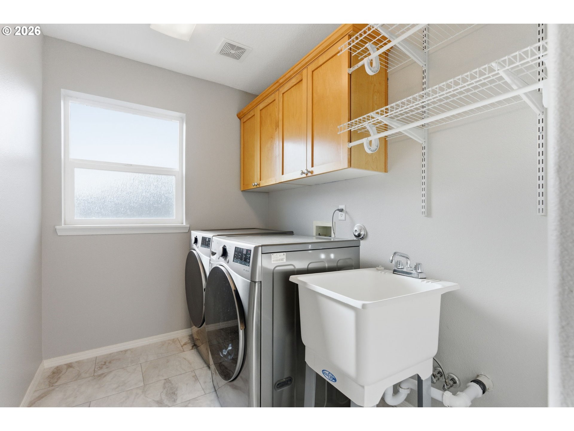 6144 Southwest 208th Place Beaverton, OR 97078 - Photo 33 of 41 a utility room with dryer and washer