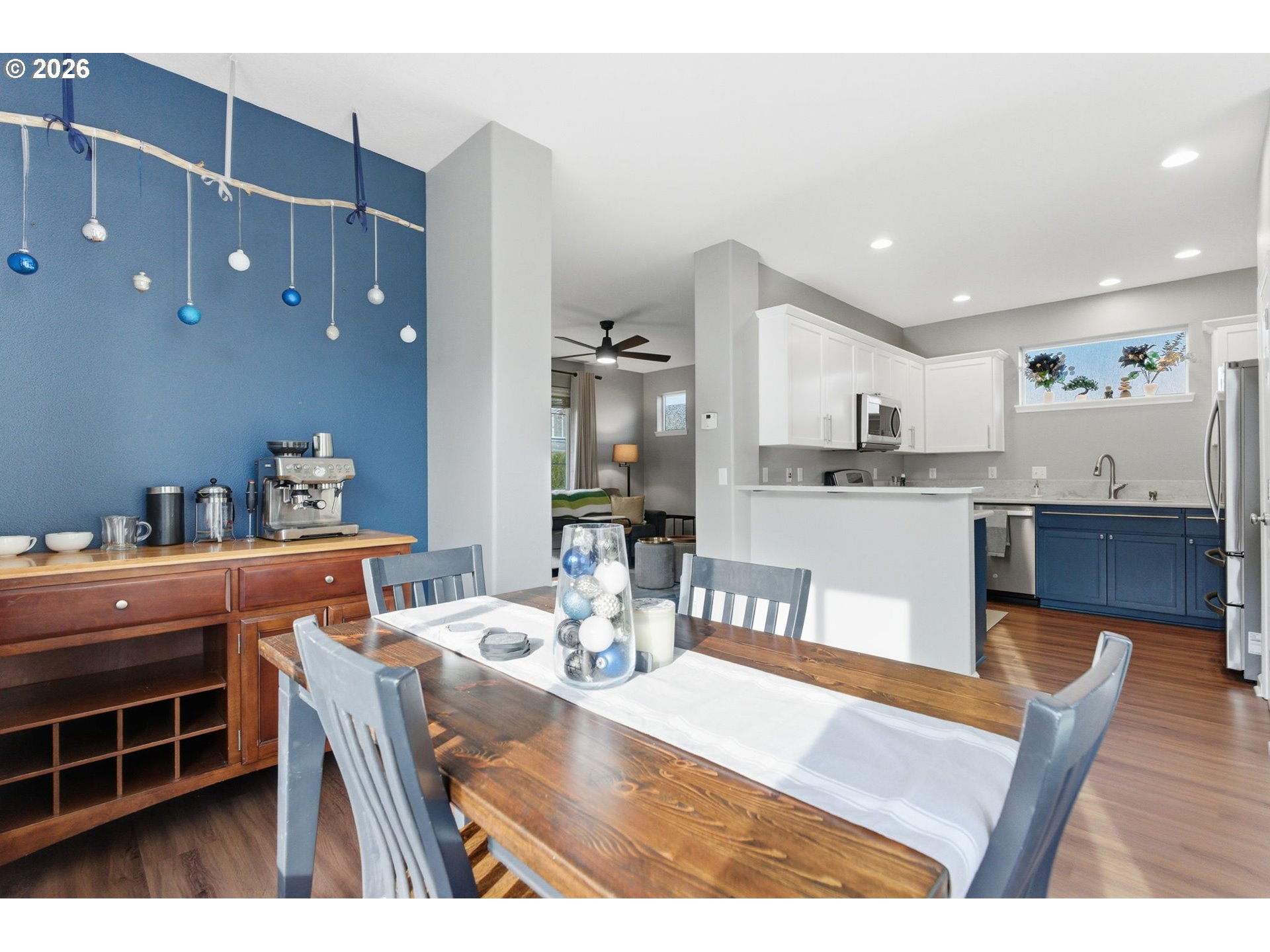 6144 Southwest 208th Place Beaverton, OR 97078 - Photo 10 of 41 a dining room with kitchen island granite countertop furniture and a view of kitchen