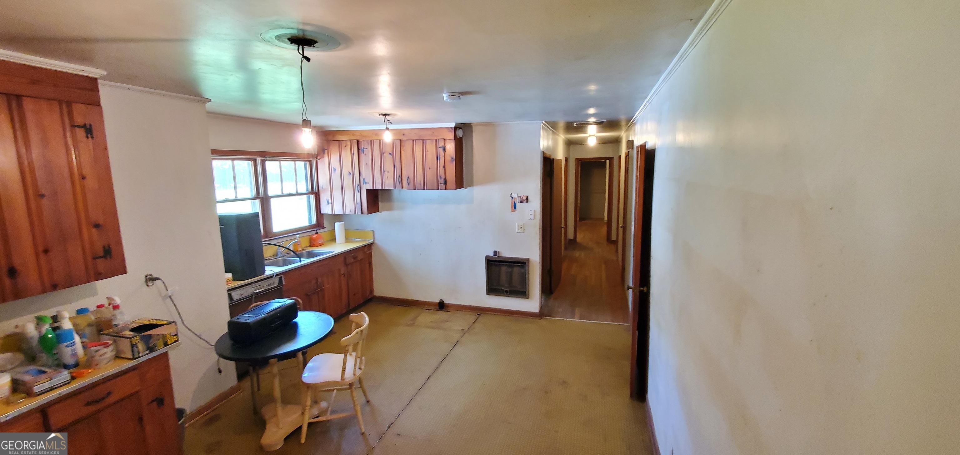 1061 Burger Road Watkinsville, GA 30677 - Photo 23 of 43 walk in closet with window and chandelier