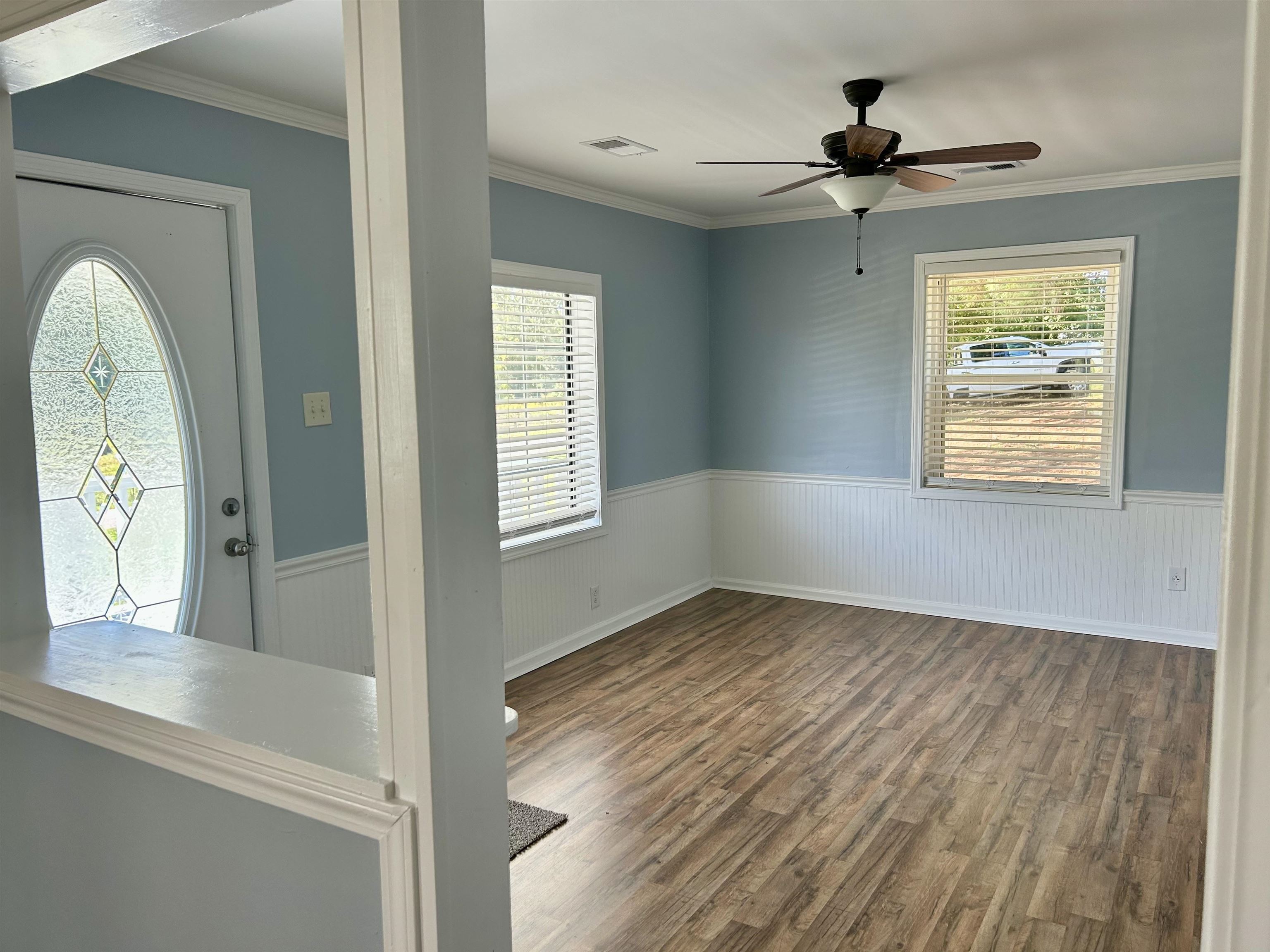 622 Bluebird Hill Road Ripley, TN 38063 - Photo 4 of 14 Foyer with a wainscoted wall, wood finished floors, ornamental molding, and a ceiling fan