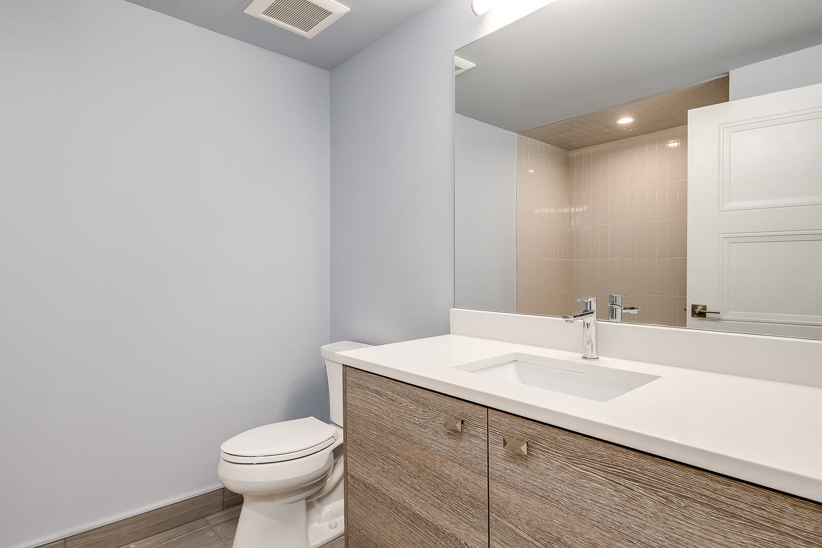 2145 South Halsted Street, Unit 4S Chicago, IL 60608 - Photo 14 of 29 a bathroom with a sink toilet and vanity