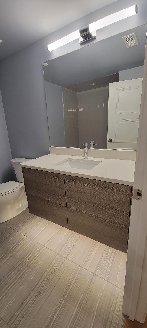 2145 South Halsted Street, Unit 4S Chicago, IL 60608 - Photo 15 of 29 a room with a vanity and mirror