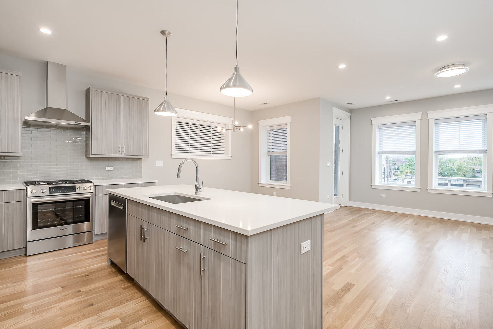 2145 South Halsted Street, Unit 4S Chicago, IL 60608 - Photo 2 of 29 a kitchen with a stove sink and cabinets