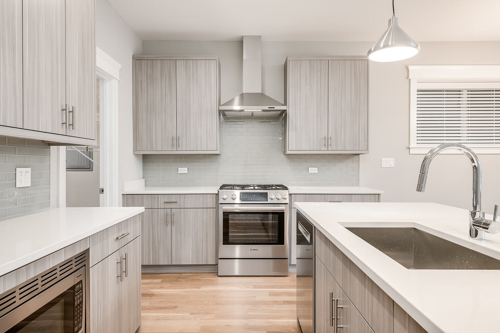 2145 South Halsted Street, Unit 4S Chicago, IL 60608 - Photo 3 of 29 a kitchen with stainless steel appliances granite countertop a sink stove and refrigerator