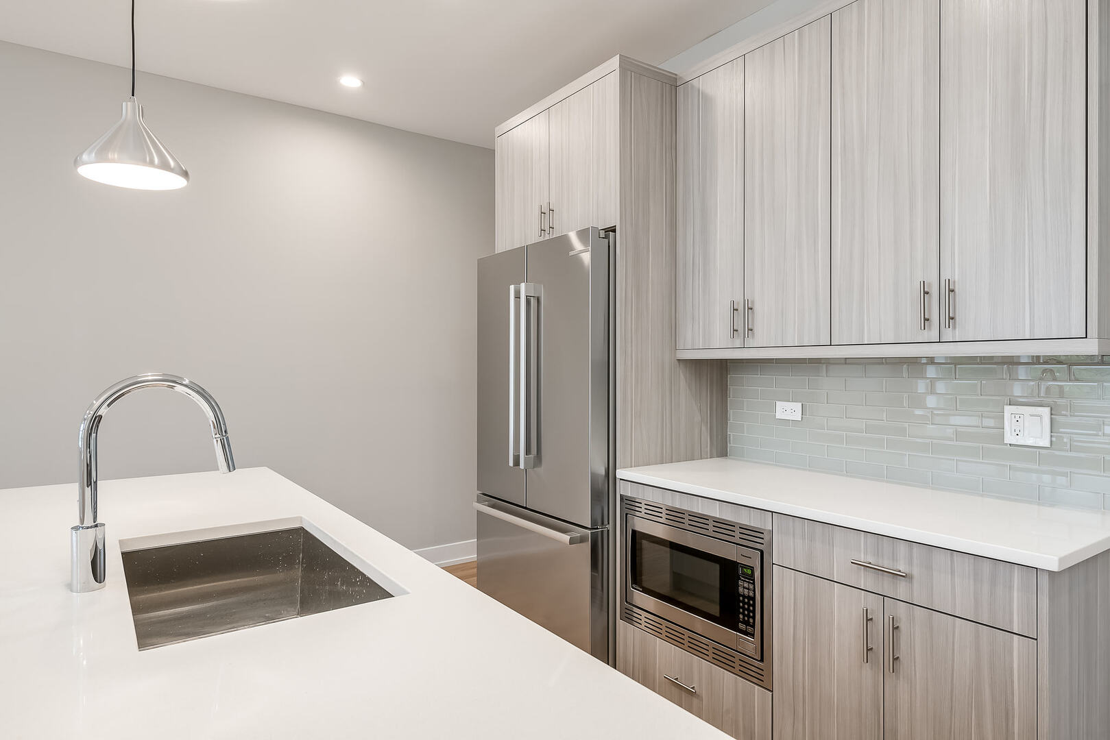 2145 South Halsted Street, Unit 4S Chicago, IL 60608 - Photo 6 of 29 a kitchen with stainless steel appliances a stove a refrigerator and white cabinets