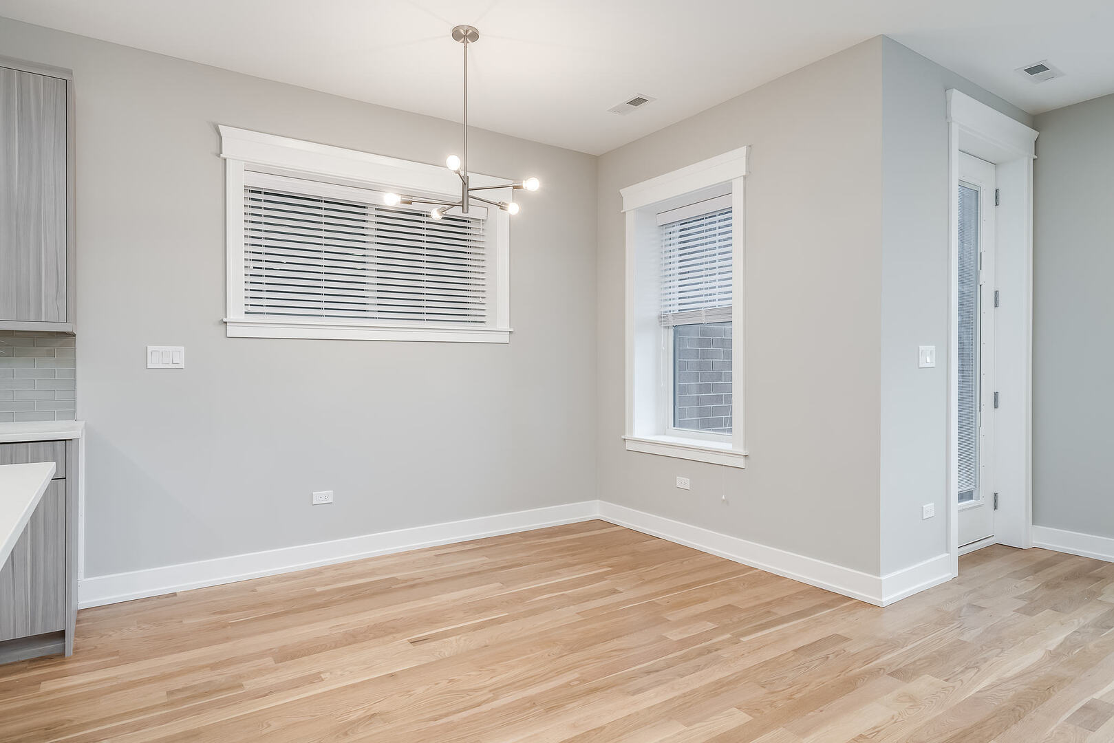 2145 South Halsted Street, Unit 4S Chicago, IL 60608 - Photo 9 of 29 a view of empty room with wooden floor and fan