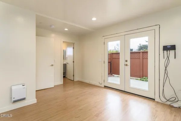 a view of entryway with wooden floor