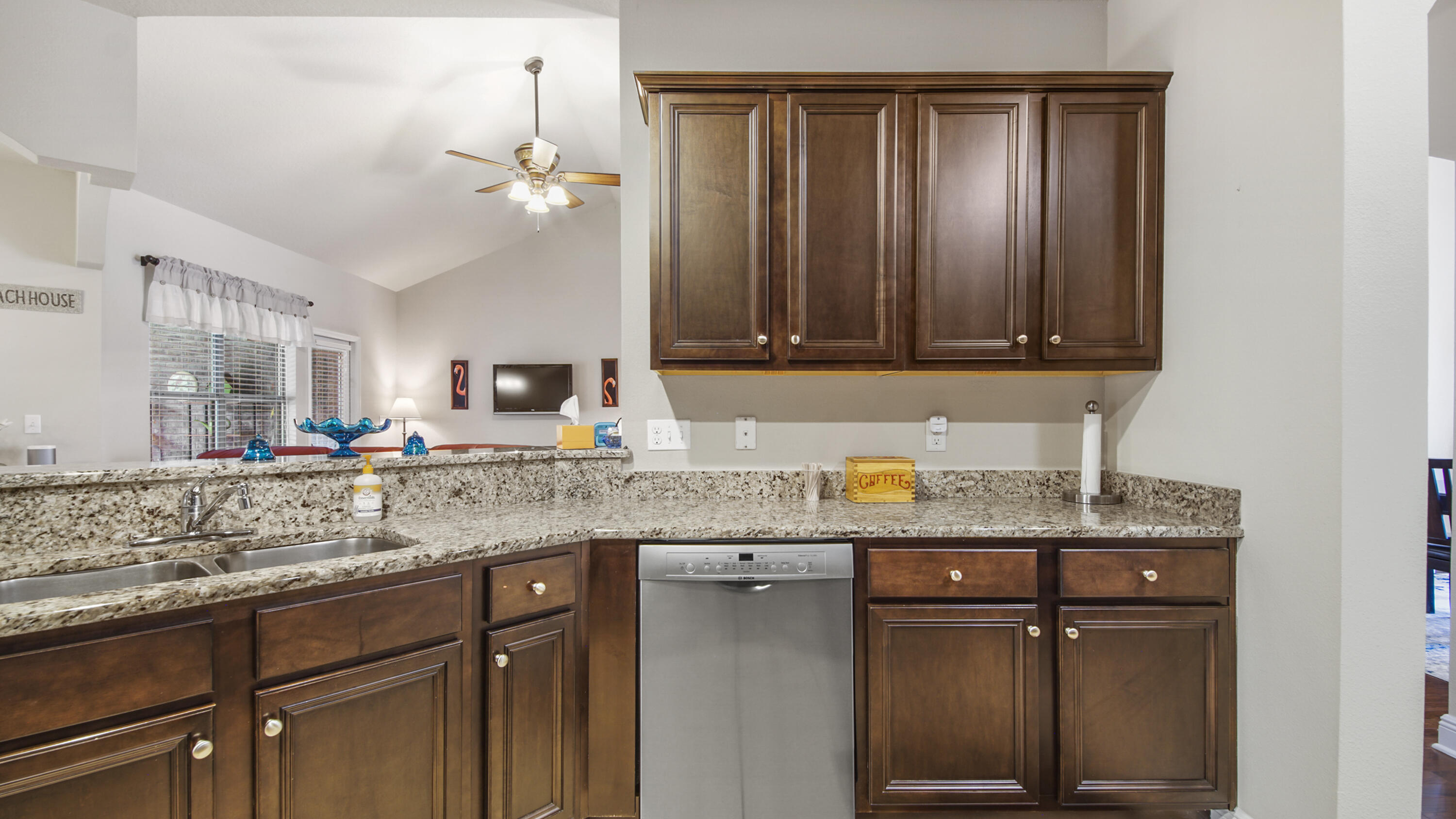 462 Mango Lane Freeport, FL 32439 - Photo 12 of 67 a kitchen with granite countertop stainless steel appliances a sink stove and cabinets