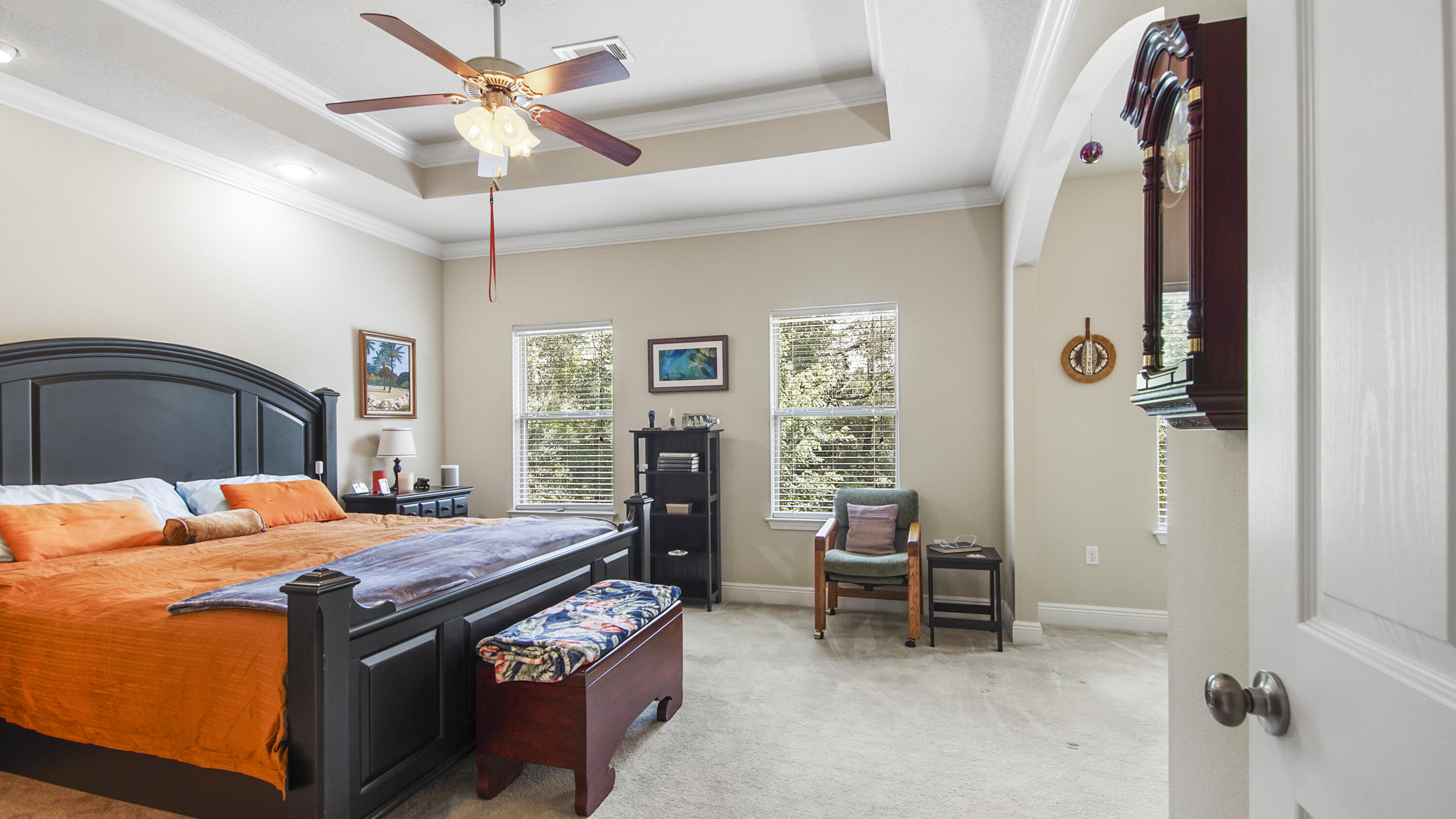 462 Mango Lane Freeport, FL 32439 - Photo 16 of 67 a bedroom with a bed and a chandelier