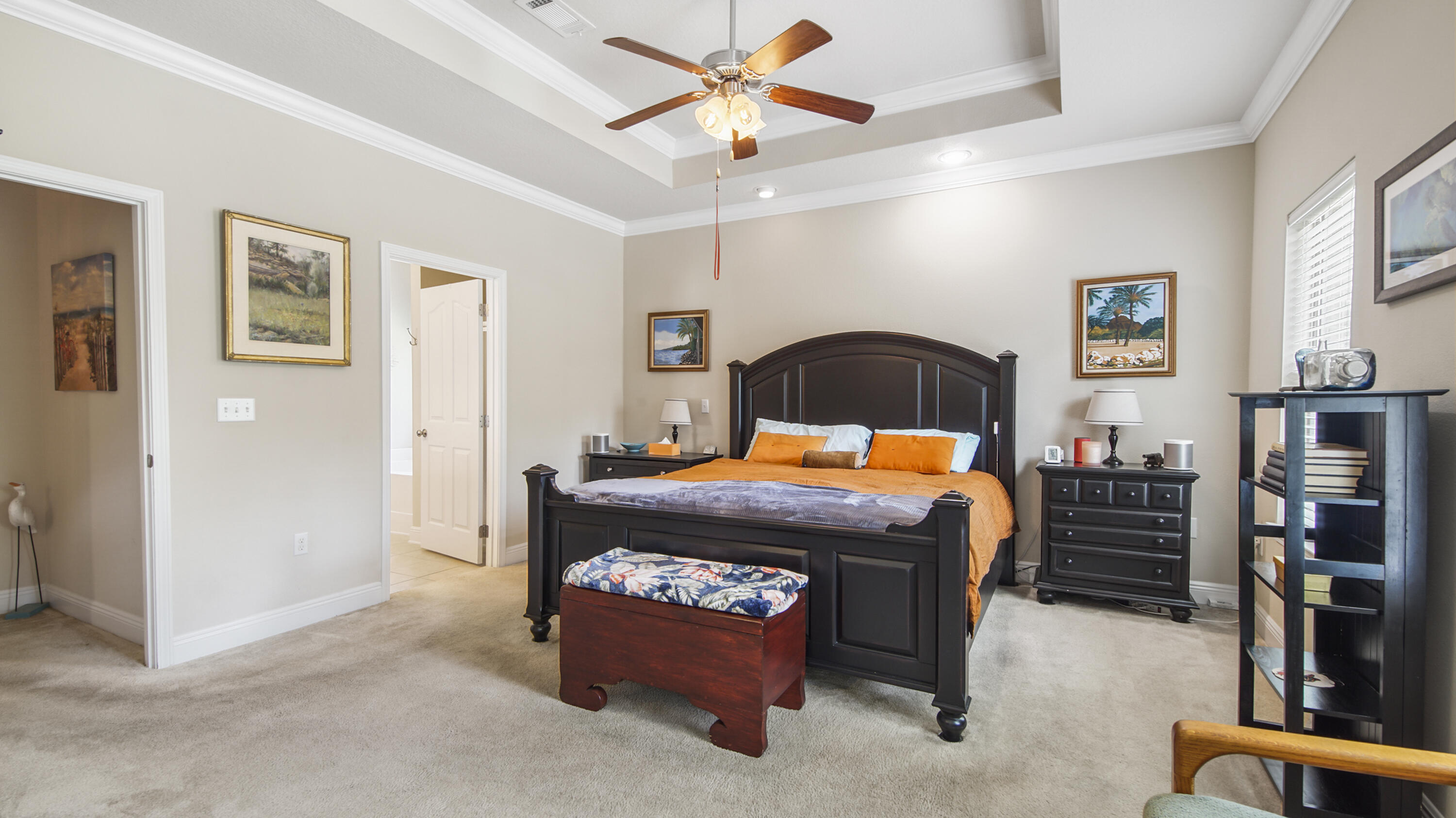 462 Mango Lane Freeport, FL 32439 - Photo 17 of 67 a bedroom with a bed and a chandelier