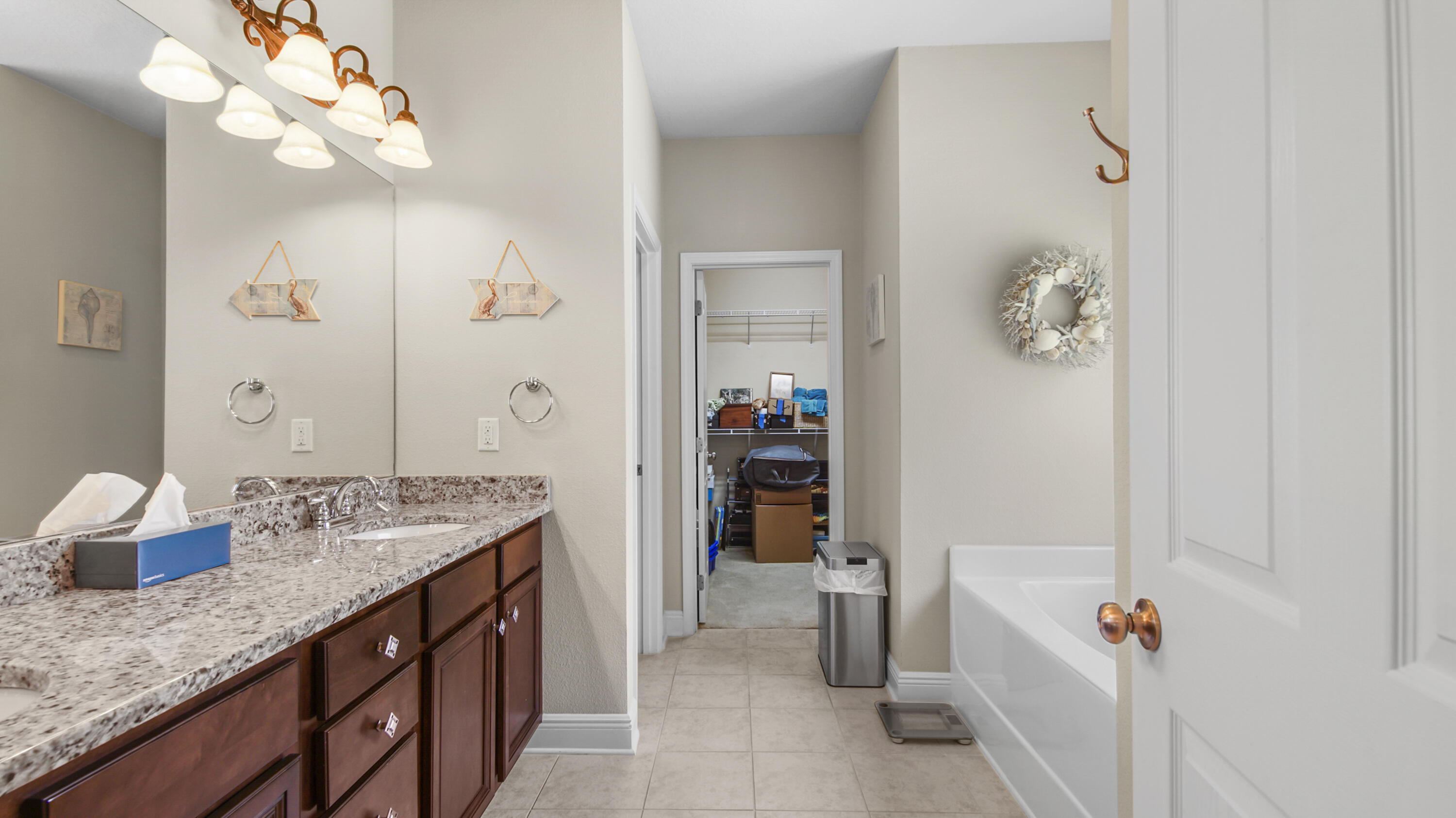 462 Mango Lane Freeport, FL 32439 - Photo 19 of 67 a bathroom with a granite countertop sink a mirror and a shower