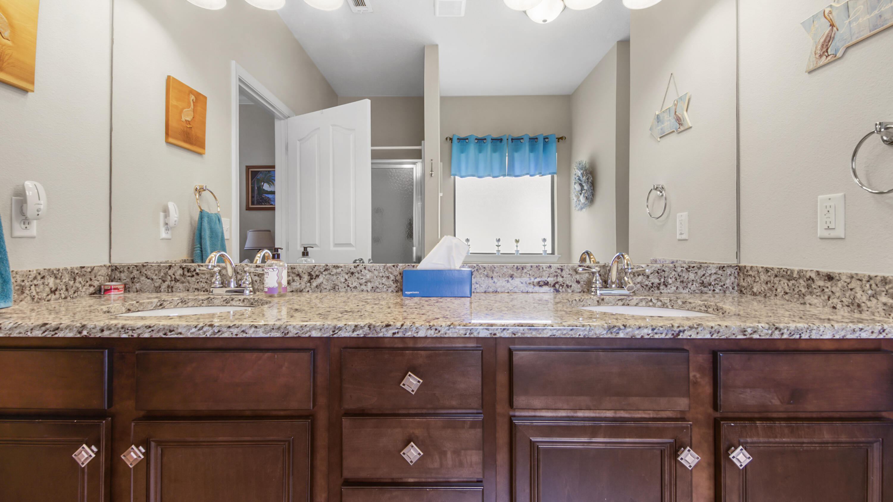 462 Mango Lane Freeport, FL 32439 - Photo 21 of 67 a bathroom with a granite countertop sink and a mirror