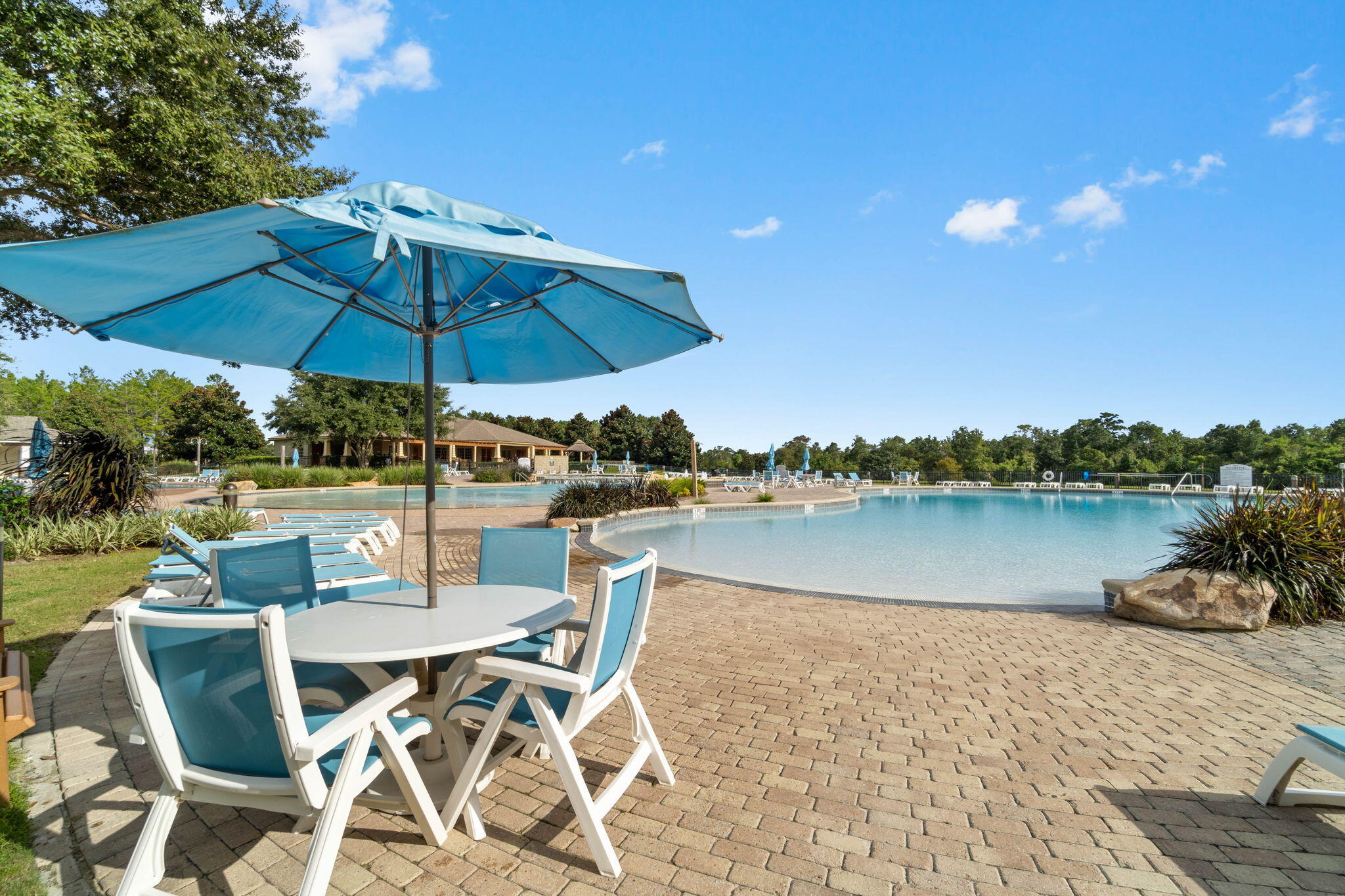 462 Mango Lane Freeport, FL 32439 - Photo 45 of 67 a view of a lake with table and chairs under an umbrella