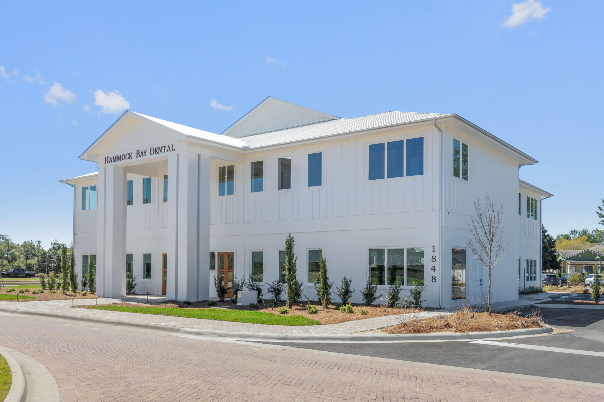 462 Mango Lane Freeport, FL 32439 - Photo 54 of 67 a front view of a building with a garden