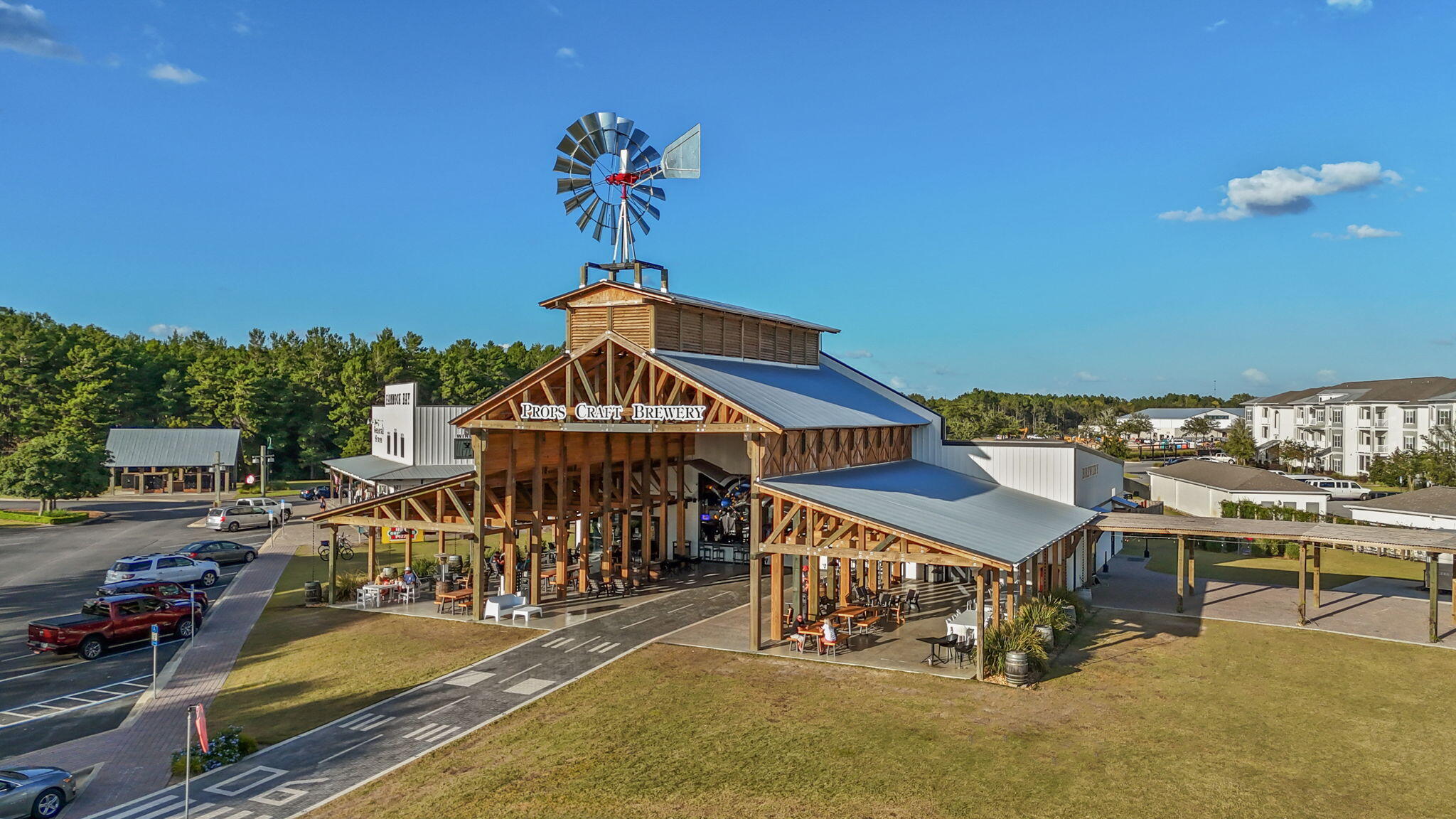 462 Mango Lane Freeport, FL 32439 - Photo 57 of 67 a roof deck with table and chairs a barbeque