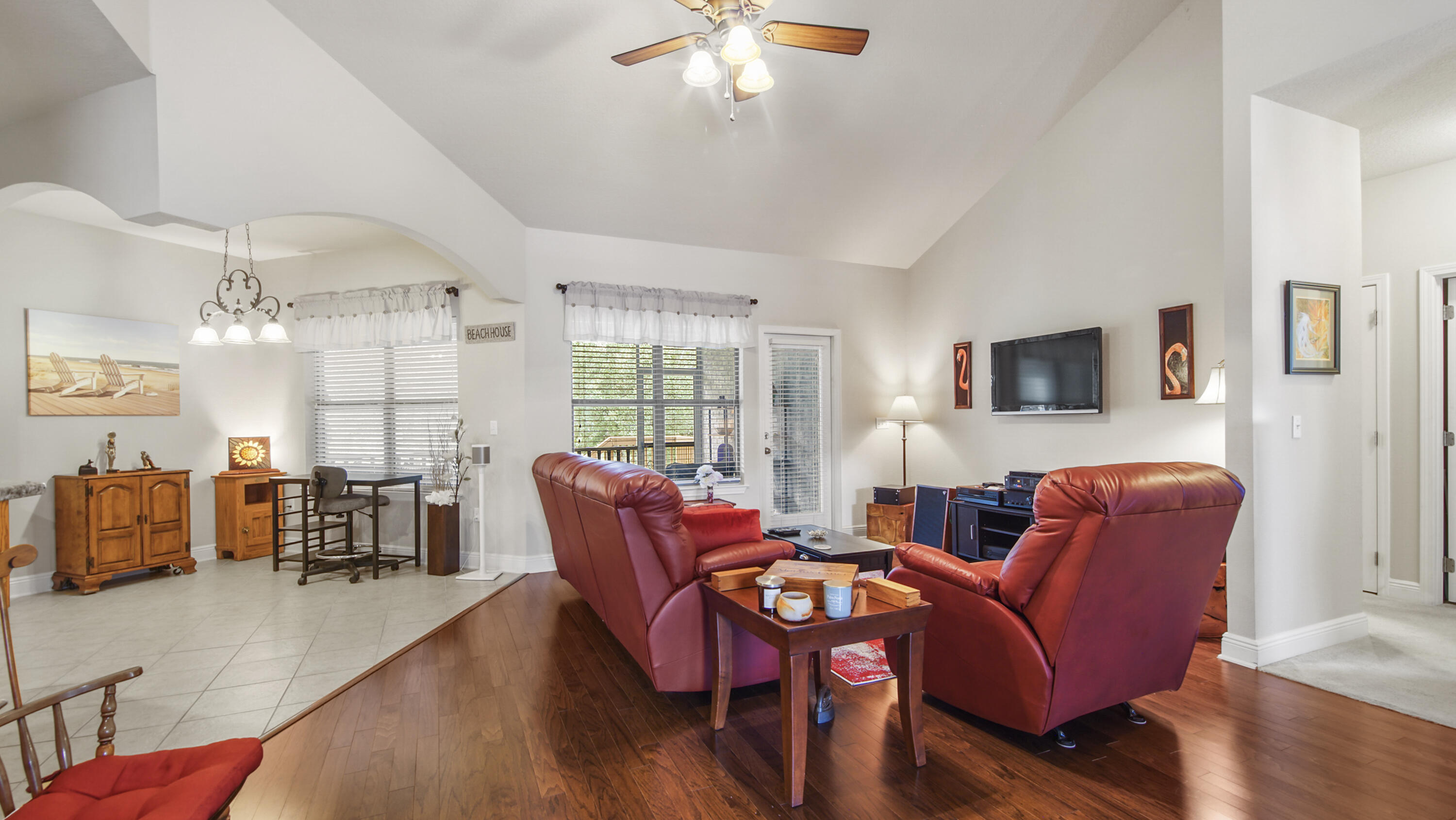 462 Mango Lane Freeport, FL 32439 - Photo 6 of 67 a dining room with furniture a chandelier and wooden floor