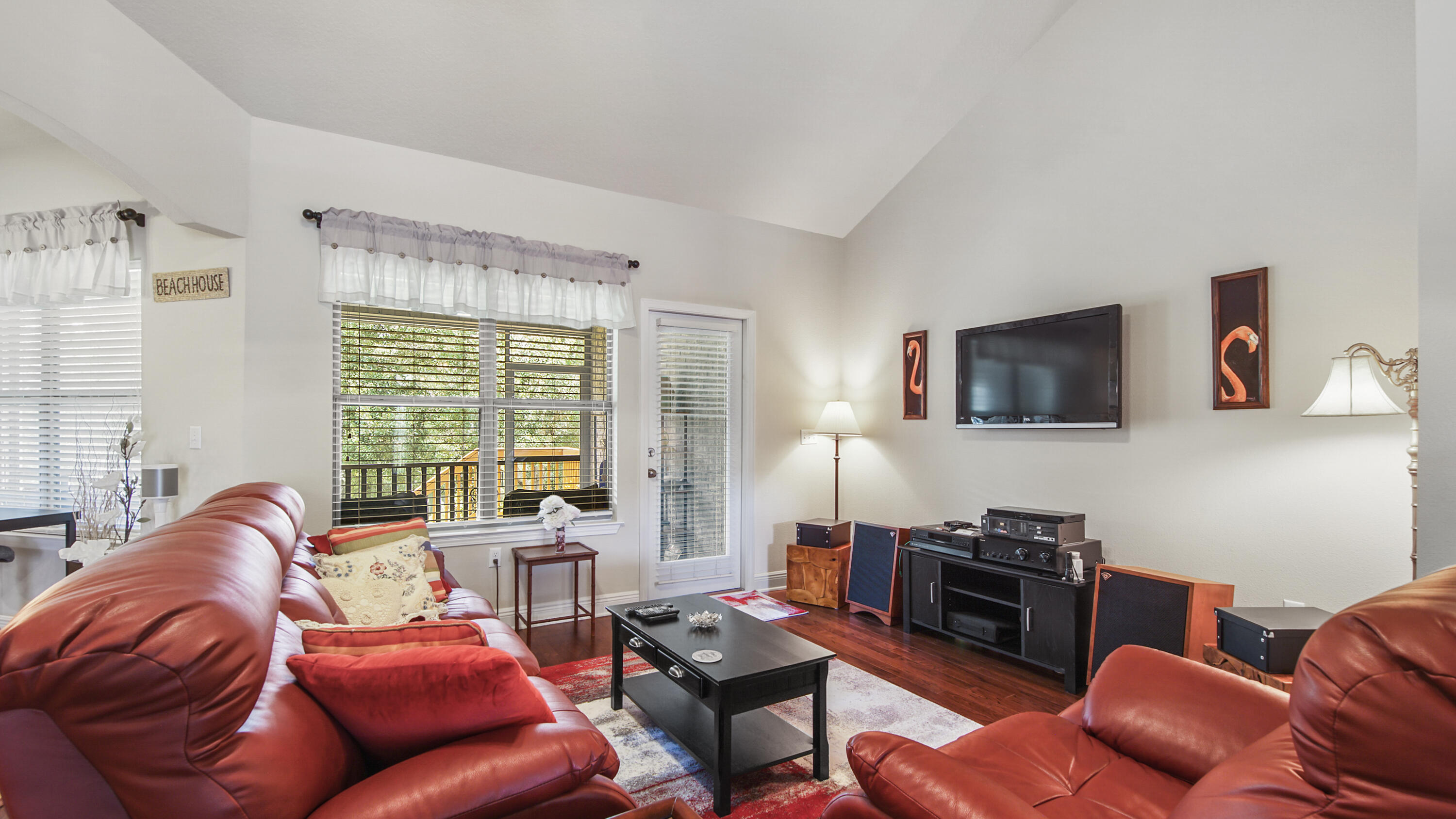 462 Mango Lane Freeport, FL 32439 - Photo 8 of 67 a living room with furniture a flat screen tv and a large window