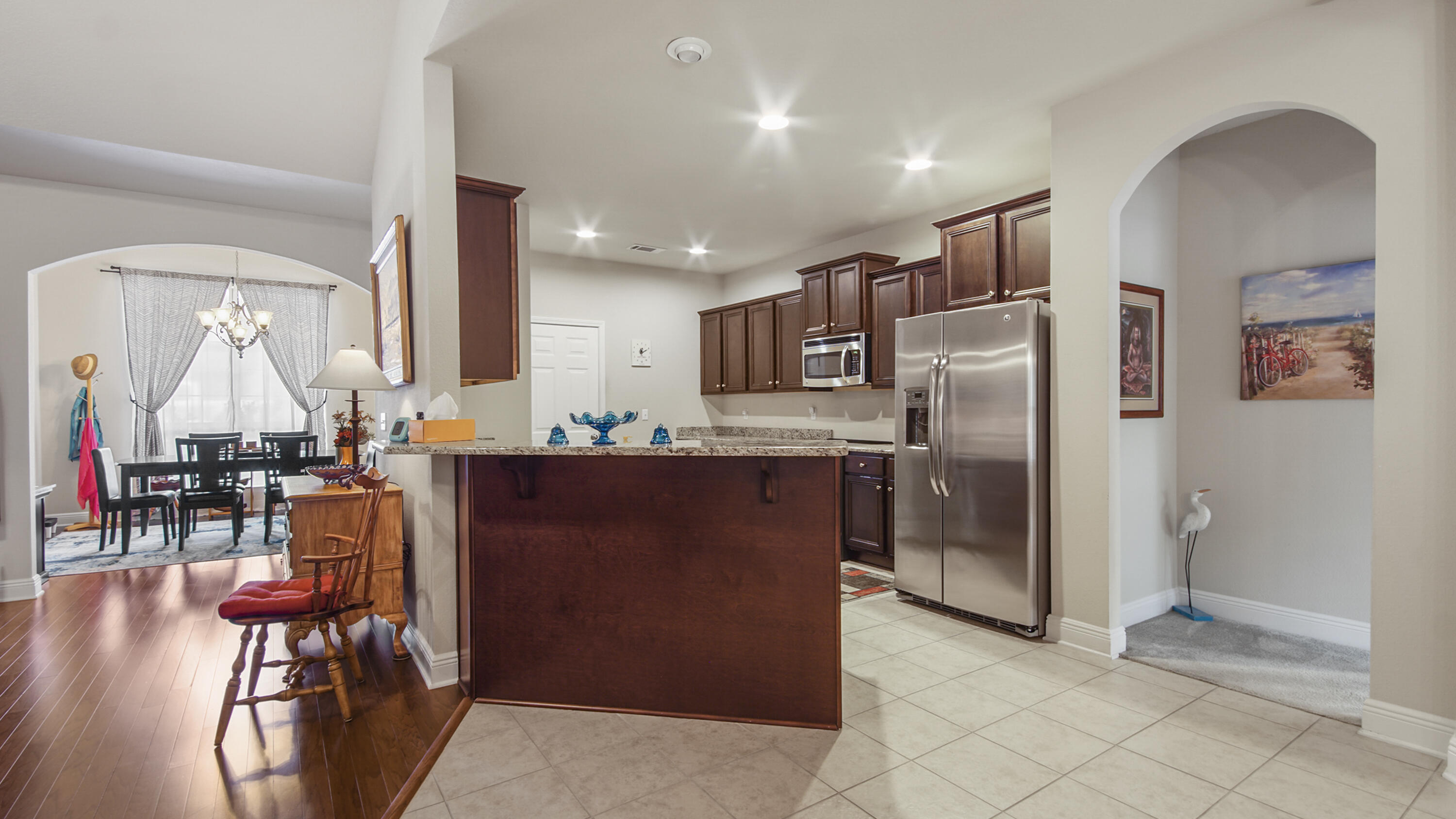462 Mango Lane Freeport, FL 32439 - Photo 10 of 67 a kitchen with stainless steel appliances kitchen island granite countertop a refrigerator and a sink