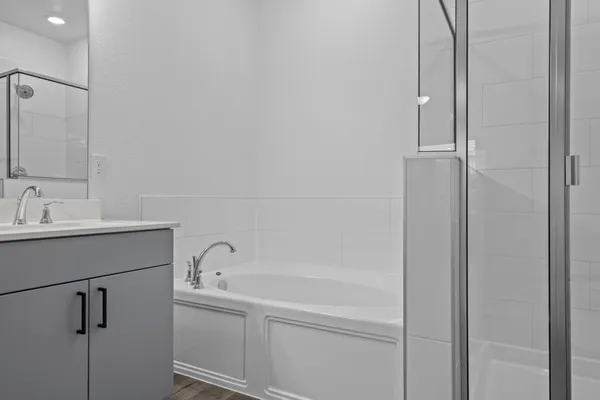 a bathroom with a shower and a sink