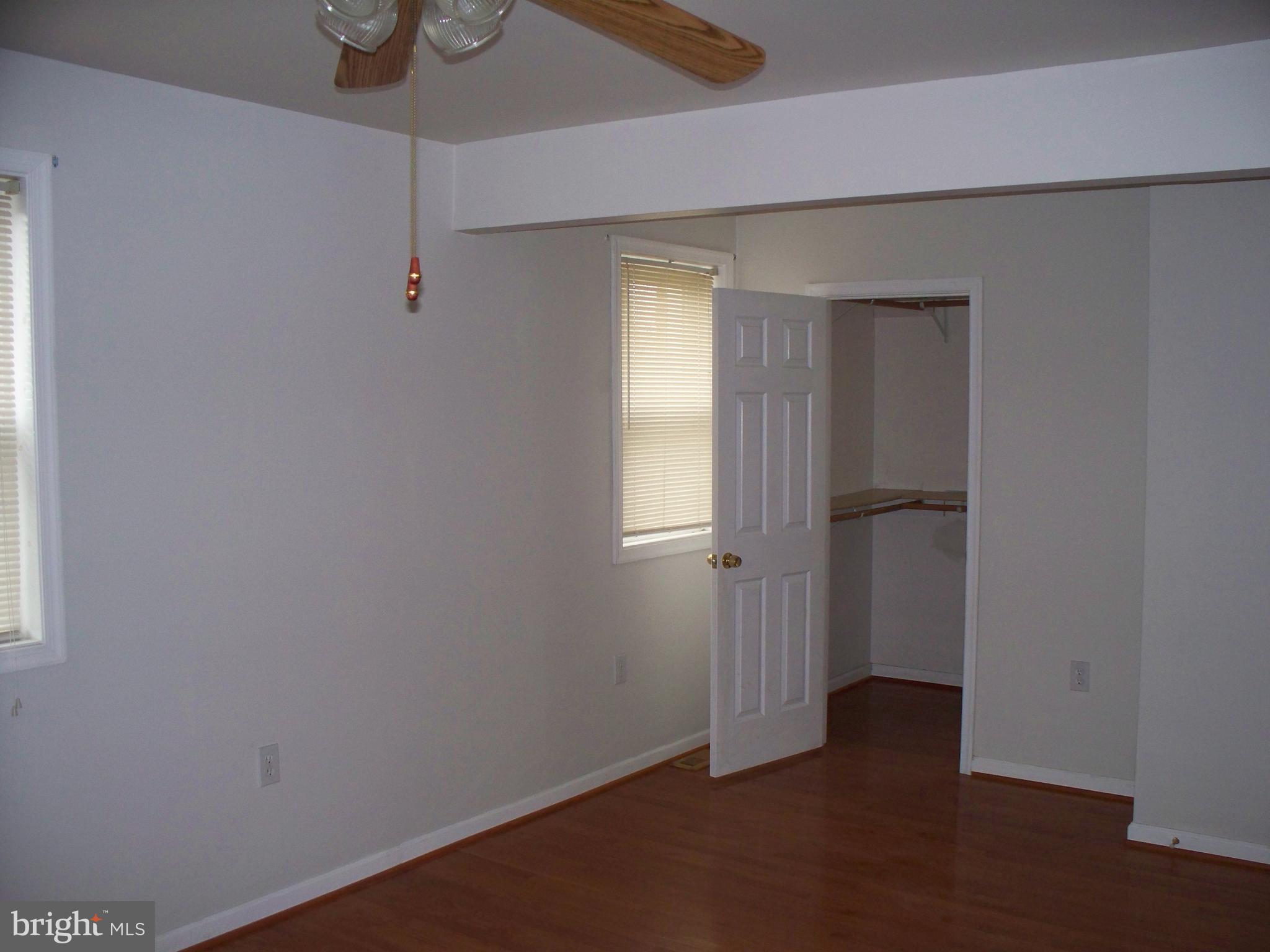 2618 Rocks Road Forest Hill, MD 21050 - Photo 13 of 20 an empty room with wooden floor closet and windows