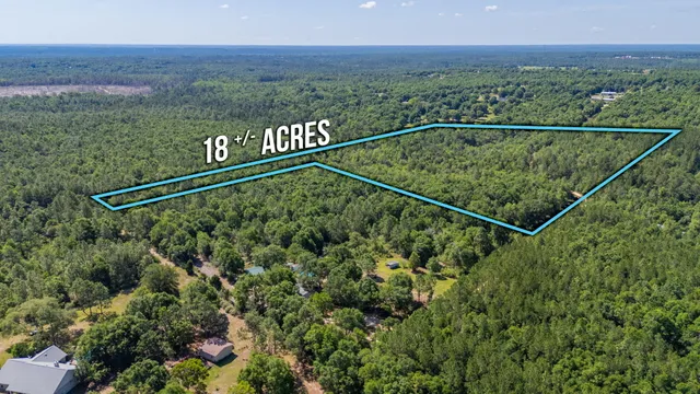 a view of a lake with a yard