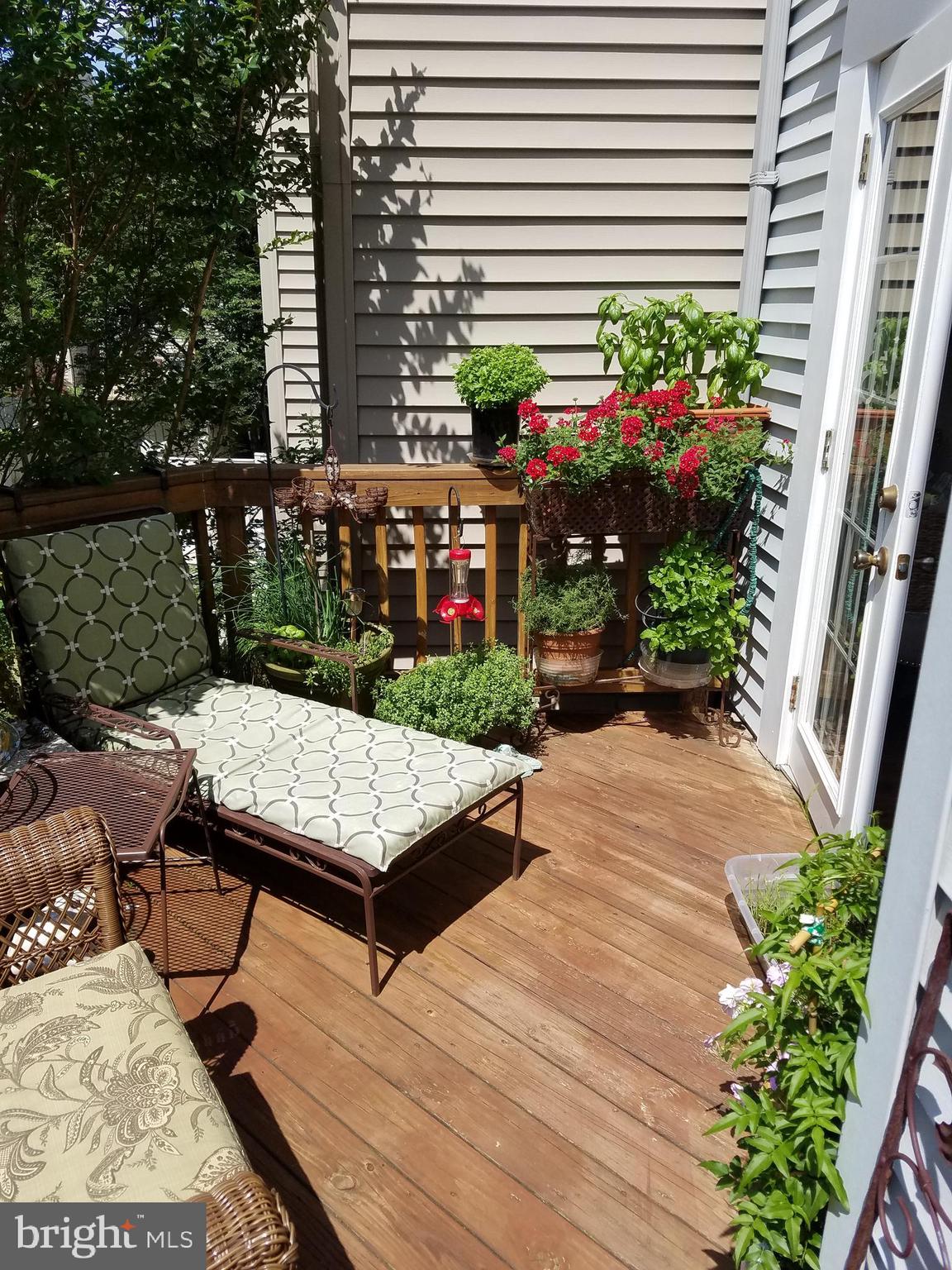 2389 Hunters Square Court Reston, VA 20191 - Photo 8 of 53 a bench sitting in front of a house