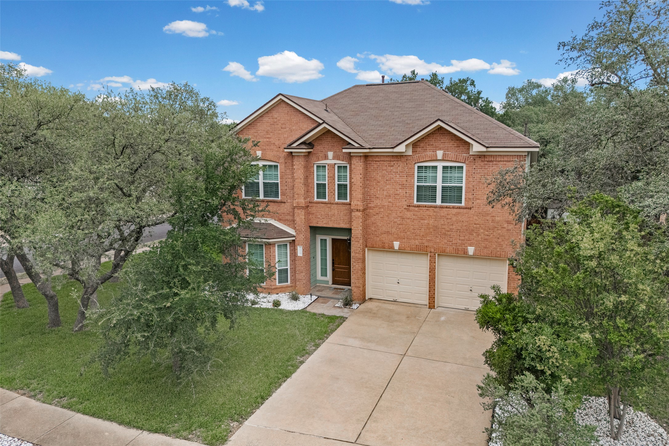 8610 Axis Drive Austin, TX 78749 - Photo 9 of 29 a front view of a house with a yard and garage