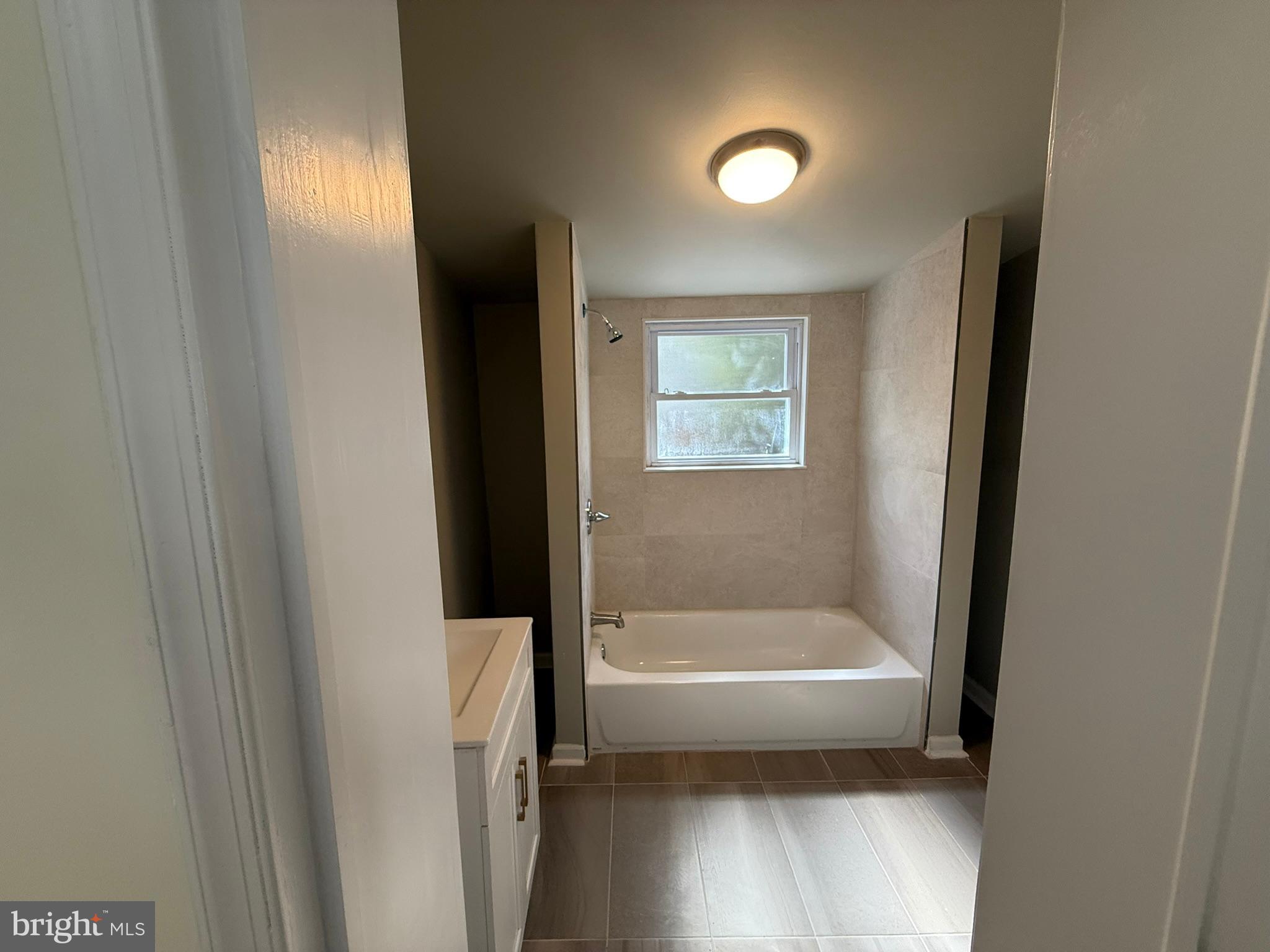 5618 Cedar Avenue, Unit 1 Philadelphia, PA 19143 - Photo 11 of 20 a bathroom with a bathtub and a shower