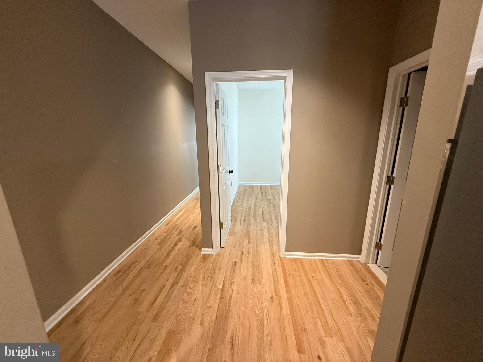 5618 Cedar Avenue, Unit 1 Philadelphia, PA 19143 - Photo 13 of 20 a view of a room with wooden floor and a staircase