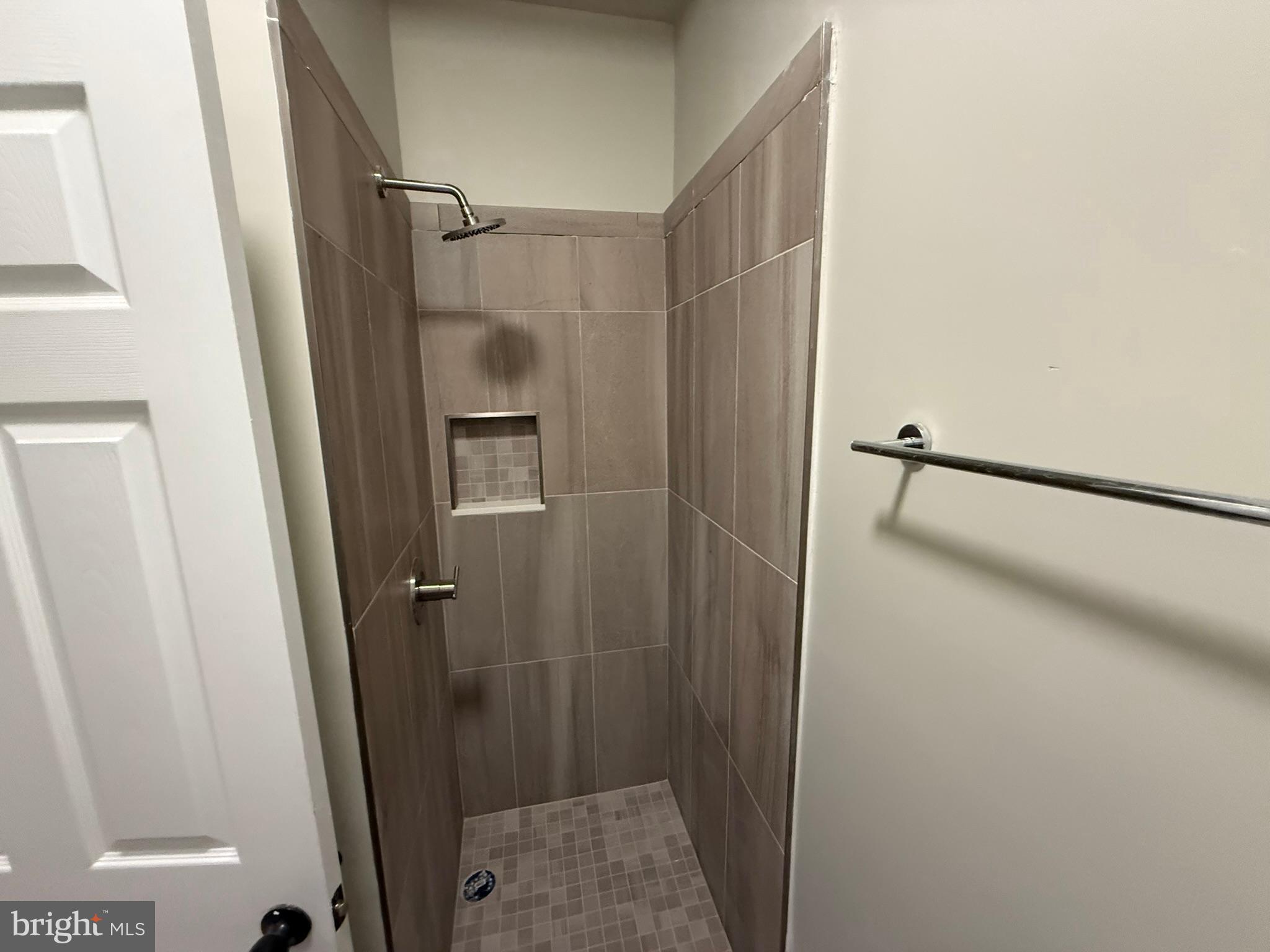 5618 Cedar Avenue, Unit 1 Philadelphia, PA 19143 - Photo 16 of 20 a bathroom with a glass door shower