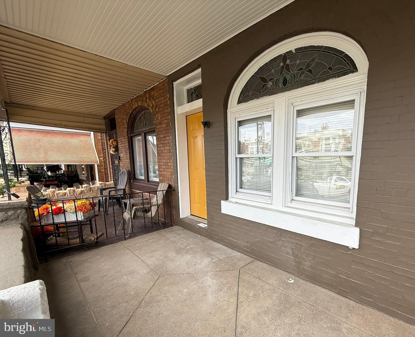 5618 Cedar Avenue, Unit 1 Philadelphia, PA 19143 - Photo 3 of 20 a view of living room with furniture and large windows