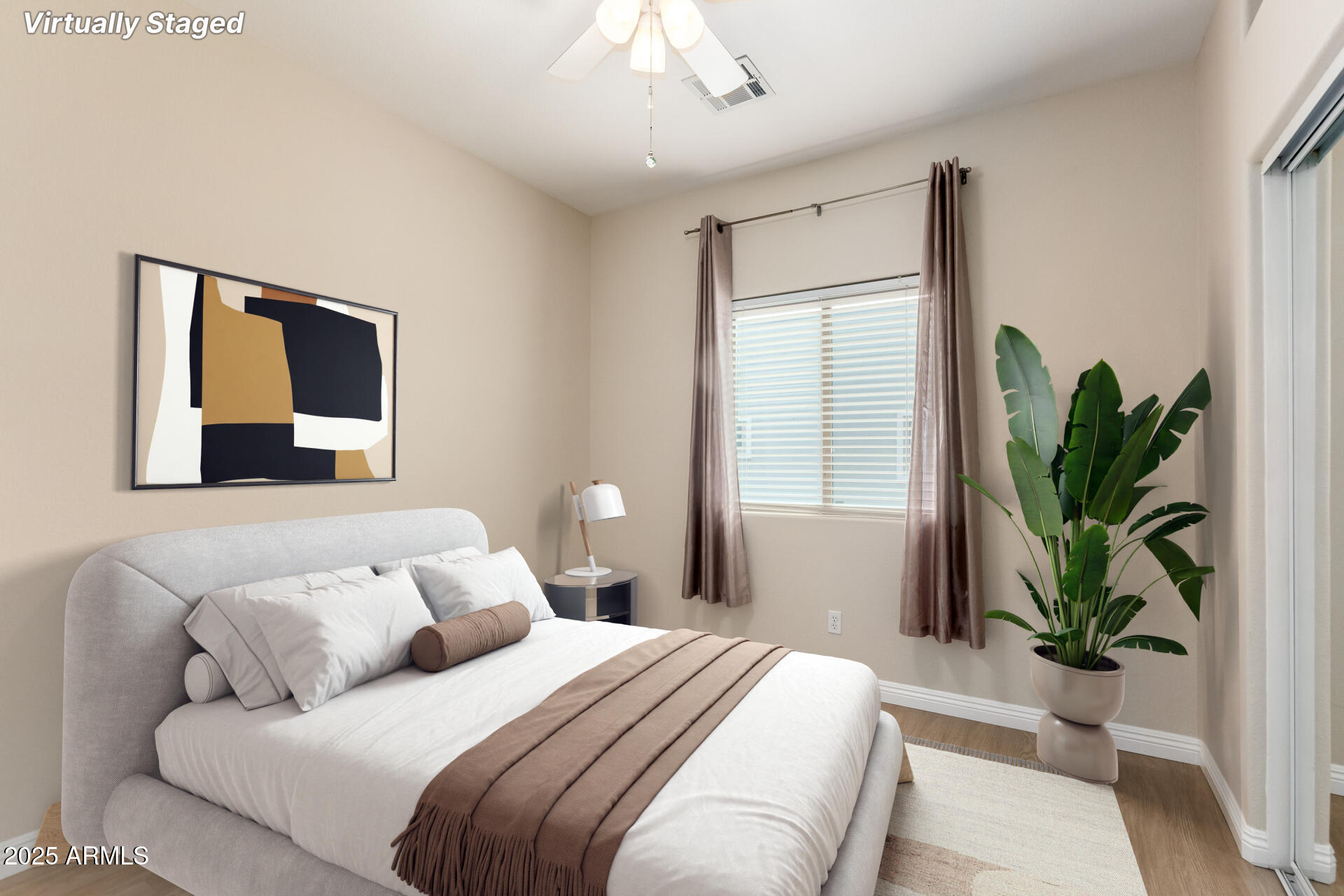 5400 South Hardy Drive, Unit 110 Tempe, AZ 85283 - Photo 14 of 31 a bedroom with a large bed and a potted plant