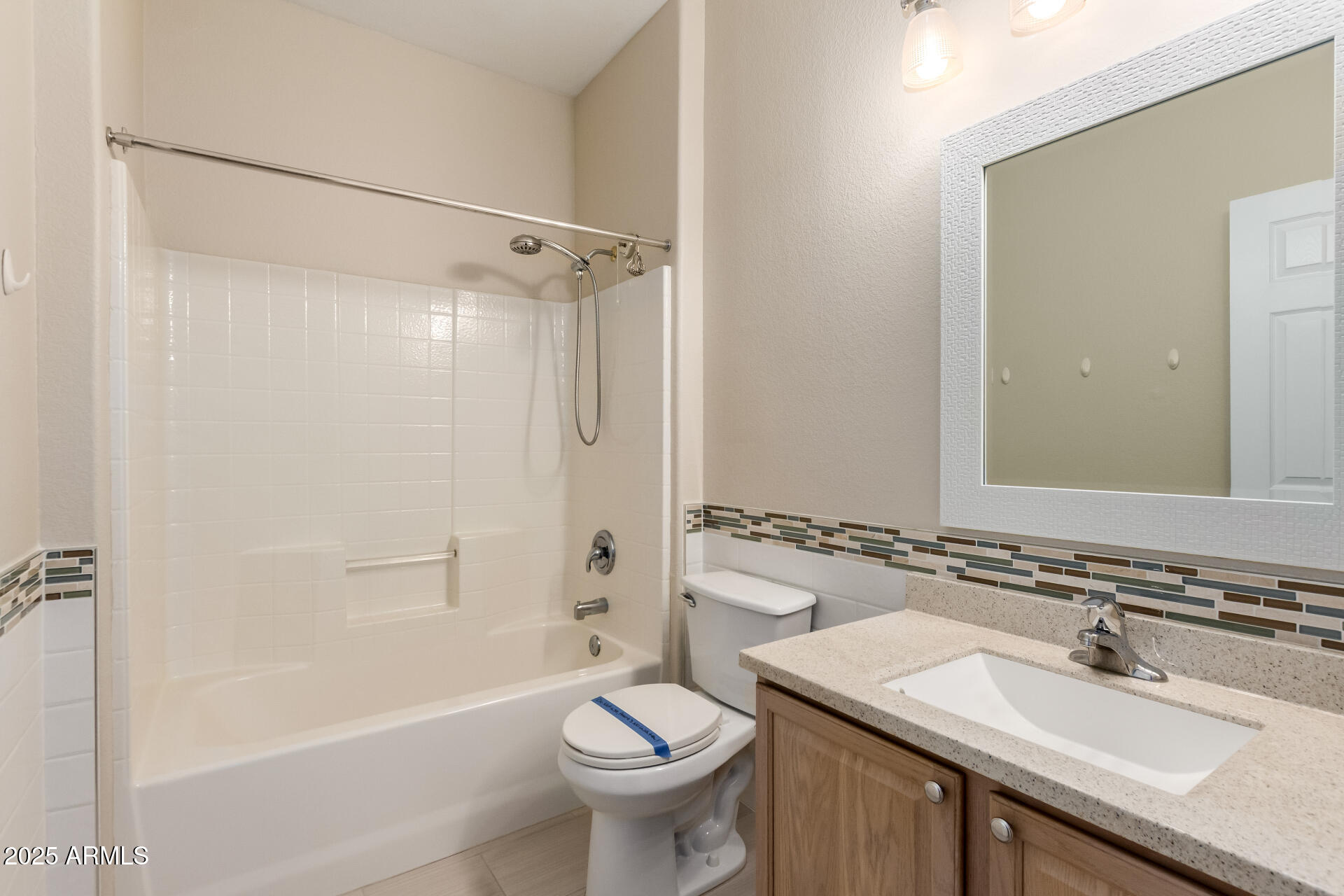 5400 South Hardy Drive, Unit 110 Tempe, AZ 85283 - Photo 22 of 31 a bathroom with a sink toilet tub and shower