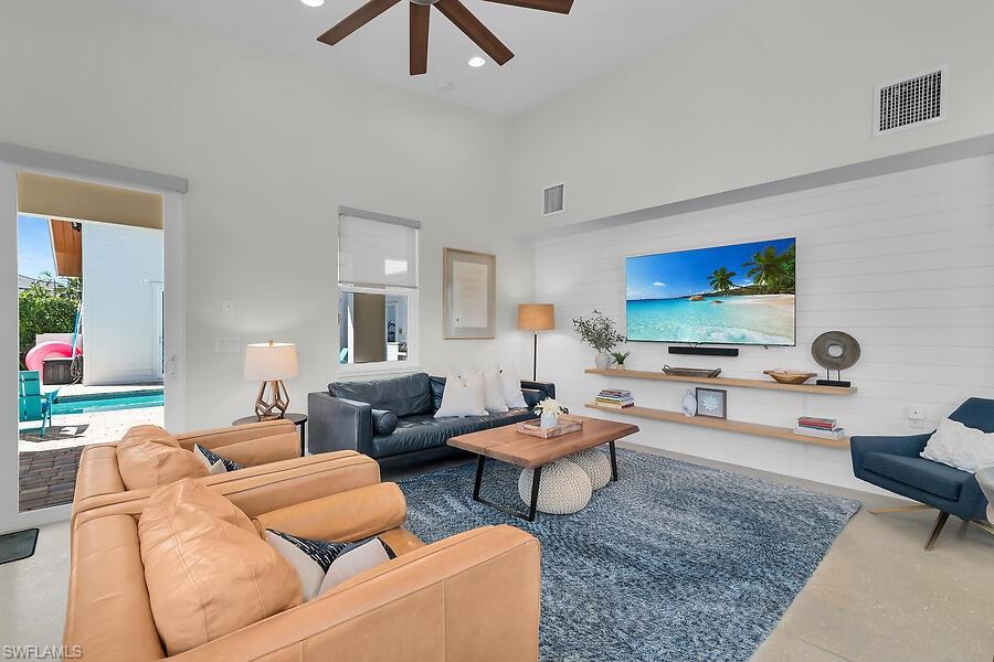 255 Columbus Way Marco Island, FL 34145 - Photo 14 of 50 a living room with furniture and a flat screen tv