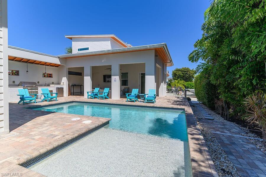 255 Columbus Way Marco Island, FL 34145 - Photo 15 of 50 a view of swimming pool with outdoor seating