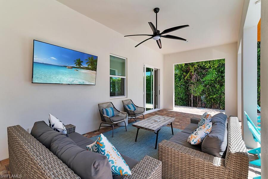 255 Columbus Way Marco Island, FL 34145 - Photo 18 of 50 a living room with furniture and a large window